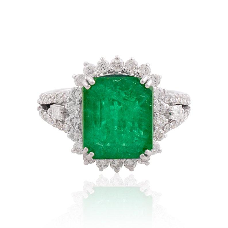 This ring has been meticulously crafted from 10-karat gold.  It is hand set with 5.08 carats emerald & .92 carats of sparkling diamonds. 

The ring is a size 7 and may be resized to larger or smaller upon request. 
FOLLOW  MEGHNA JEWELS storefront