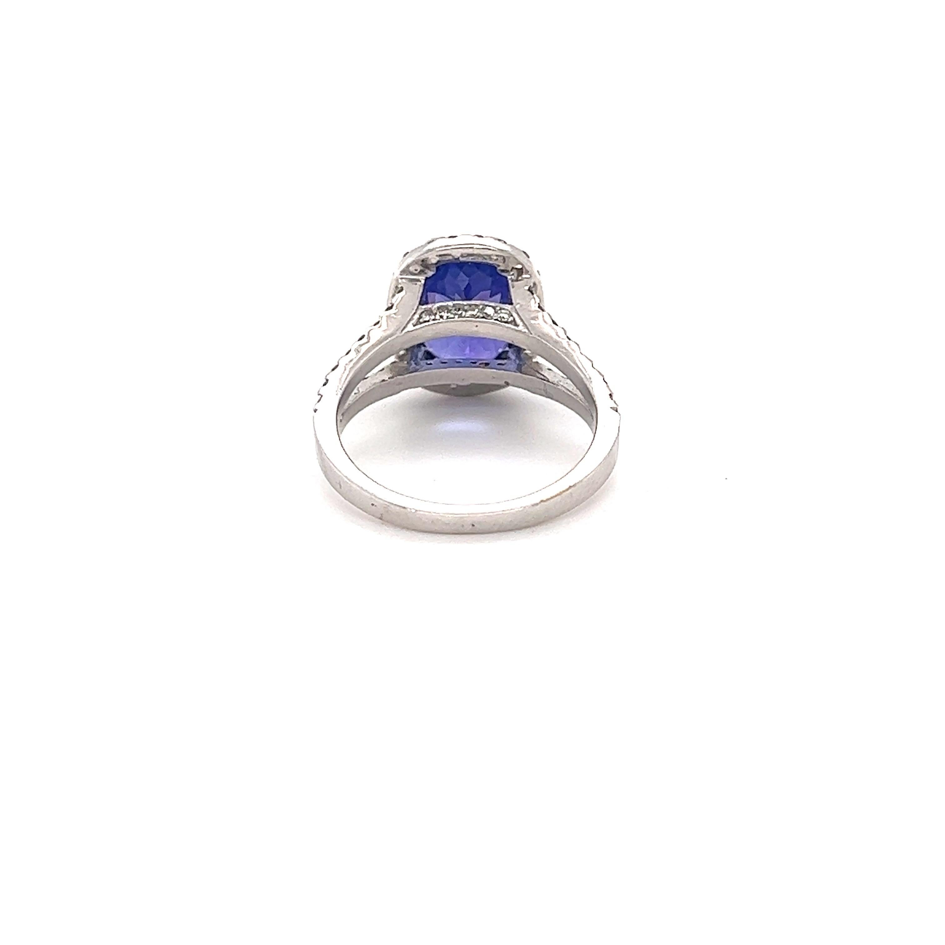 Oval Cut 5.08 Carat Tanzanite Diamond 14 Karat White Gold Ring For Sale