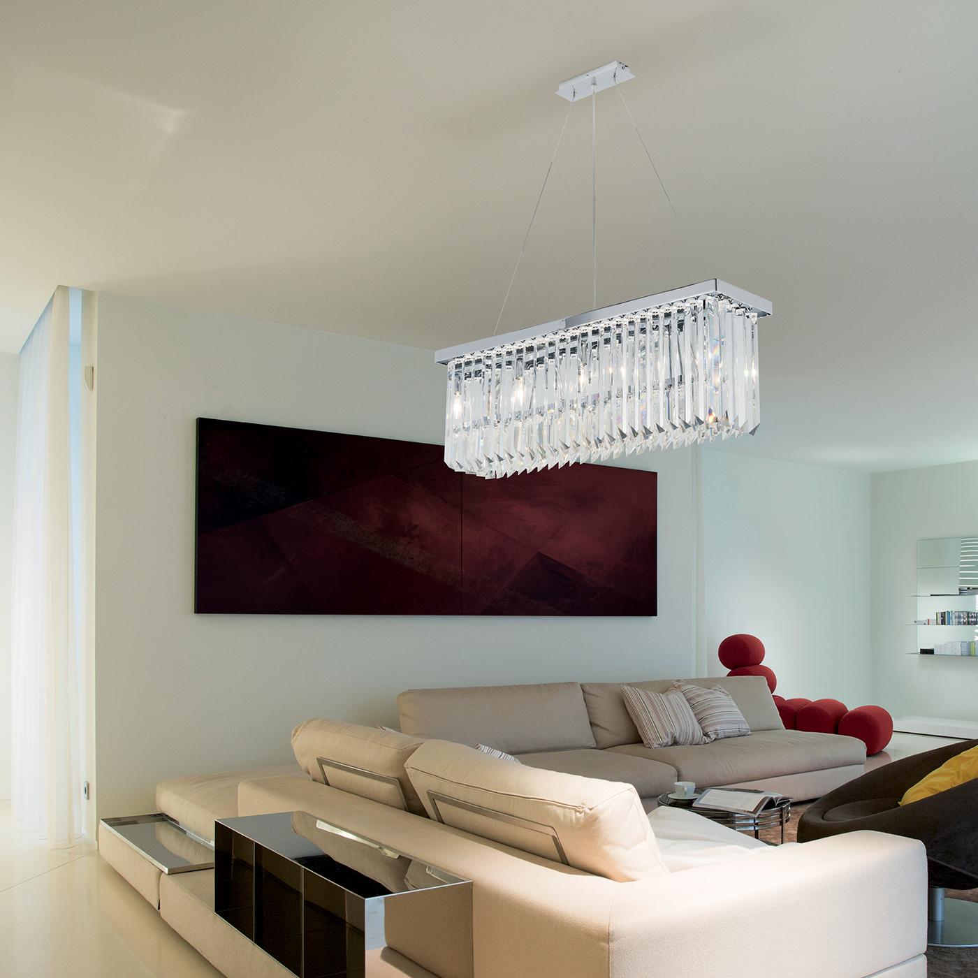 This rectangular pendant light is crafted from clear lead crystal, offering a modern take on a classic chandelier style. Transforming any dining area when hung directly above the table as a striking focal point, the crystal drop oblong pendant light