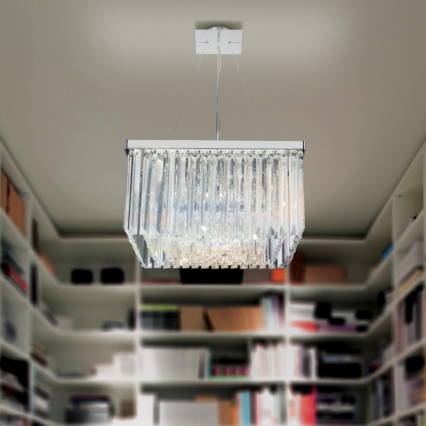 This stylish ceiling light updates a Classic chandelier style with a contemporary twist. Long clear lead crystal strips are arranged into a sleek square configuration, which makes a sophisticated focal point when hung directly above a dining table