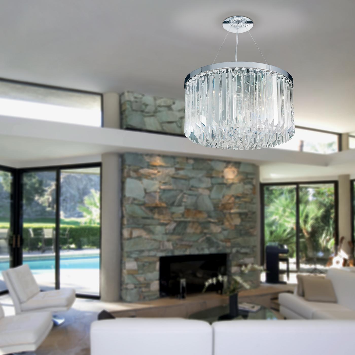 The crystal drop round pendant light fuses traditional and modern styling, reworking a classic chandelier design with a contemporary edge. Crafted from transparent lead crystal, its concentric circle configuration makes a stunning focal point in any