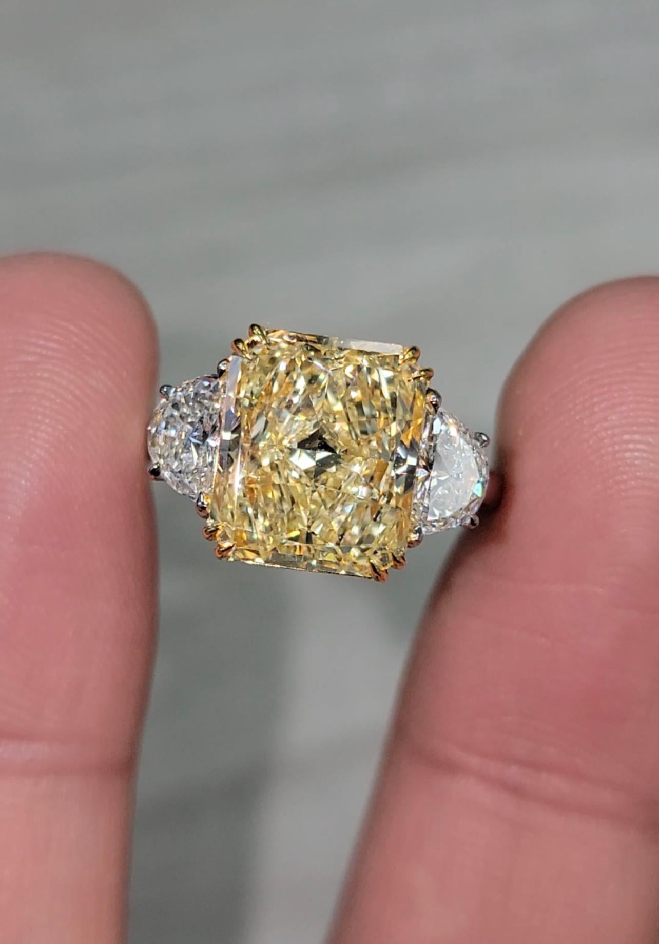 Well made and laid out 5ct Fancy Yellow long radiant set in platinum and 18kt YG with 0.82ct of F VS Half moons


Making Extraordinary Attainable with Rare Colors
