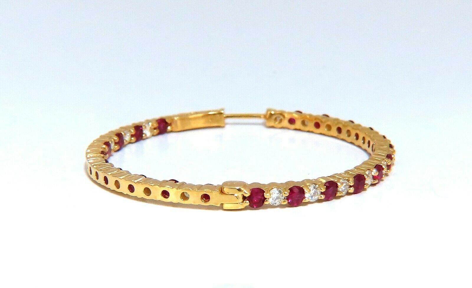 Inside/out  natural Ruby and Diamond hoop earrings.

3.40ct. round rubies, full brilliant cut clean clarity and transparent

1.68ct. natural round diamonds h color vs2 clarity.

14 karat rose gold 11.1 gram

42 mm wide (front to back)

2.5 mm wide