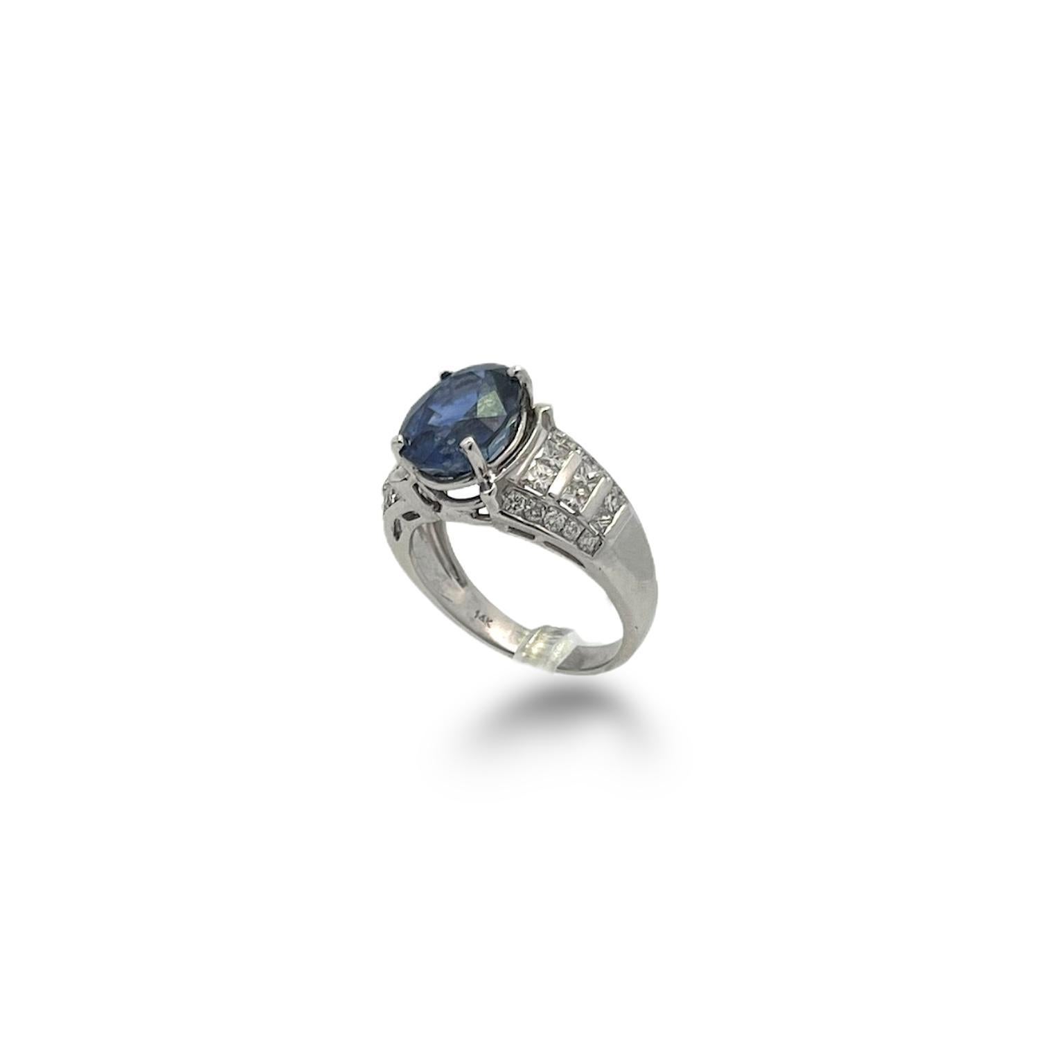 5.08ct Oval Sapphire Ring with 1.00ctw Princess Cut Diamonds and Round Brilliant Diamonds

This stunning 5.08 carat Oval Blue Sapphire rests in a 14k white gold basket setting with 1.00ctw princess cut diamonds 32 round brilliant side stones. This
