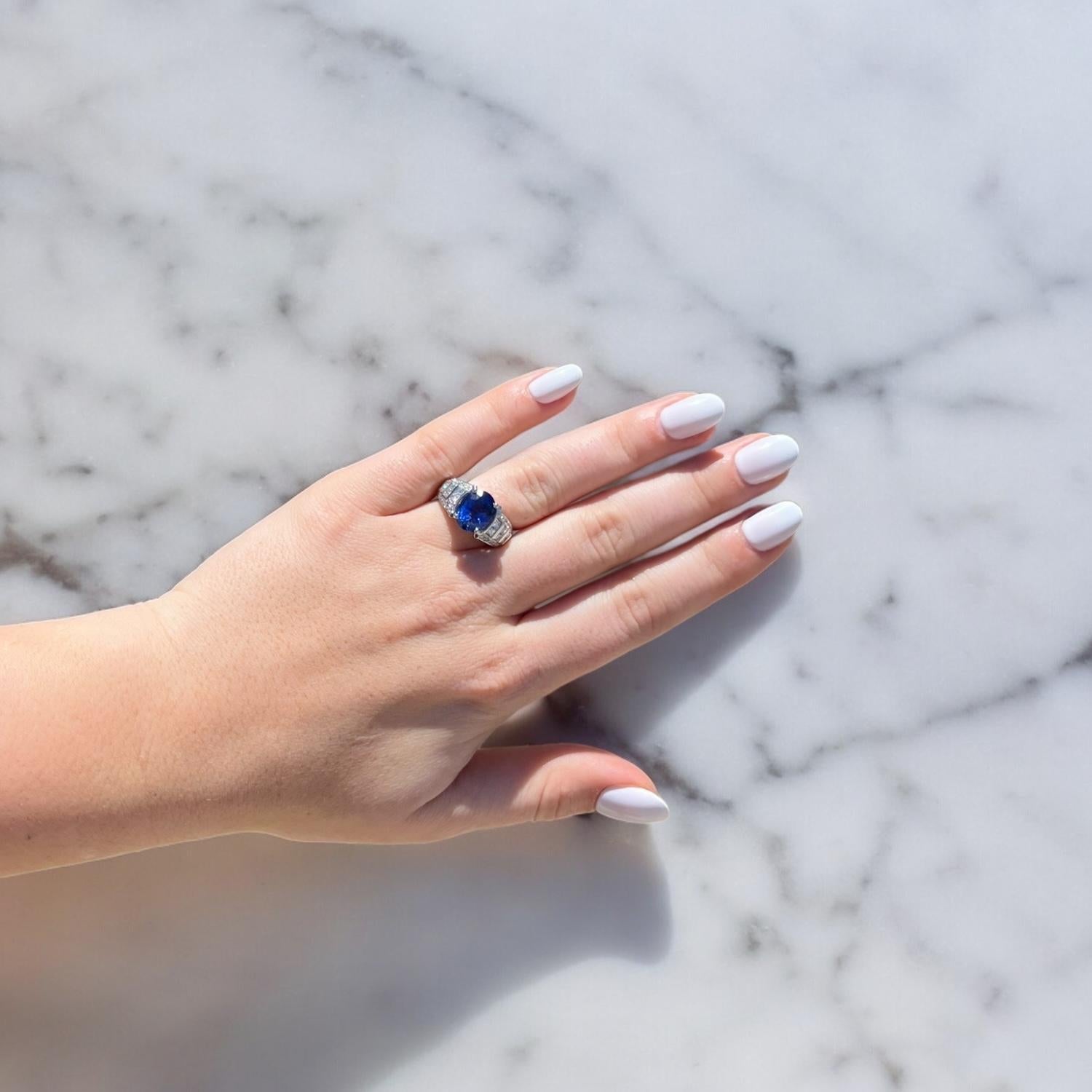 5.08ct Oval Sapphire Ring with 1.00ctw Round Brilliant and Princess Cut Diamonds For Sale 2