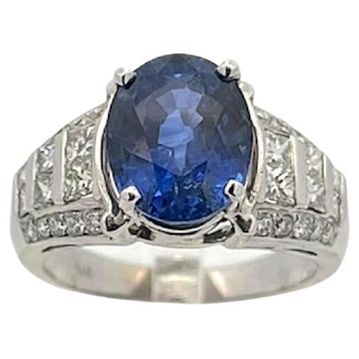 5.08ct Oval Sapphire Ring with 1.00ctw Round Brilliant and Princess Cut Diamonds For Sale