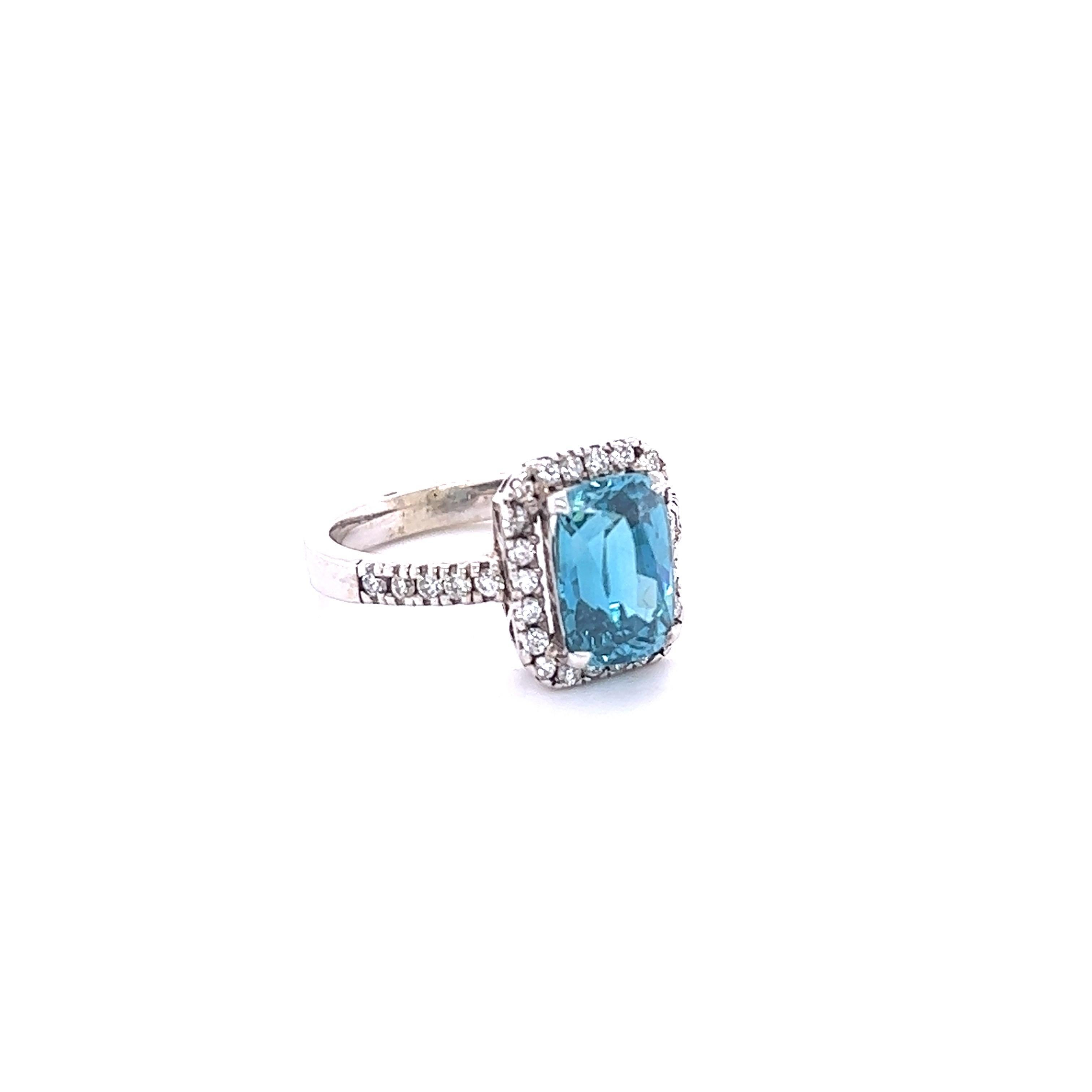 Blue Zircon is a natural stone mined mainly in Sri Lanka, Myanmar, and Australia.  
This ring has a Emerald-Oval Cut Blue Zircon that weighs 4.66 carats and is surrounded by 32 Round Cut Diamonds that weigh 0.43 Carats. The total carat weight of the