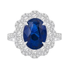 5.09 Carat Natural Oval Blue Sapphire 'GIA' Flower Style Diamond Ring, 18 Karat