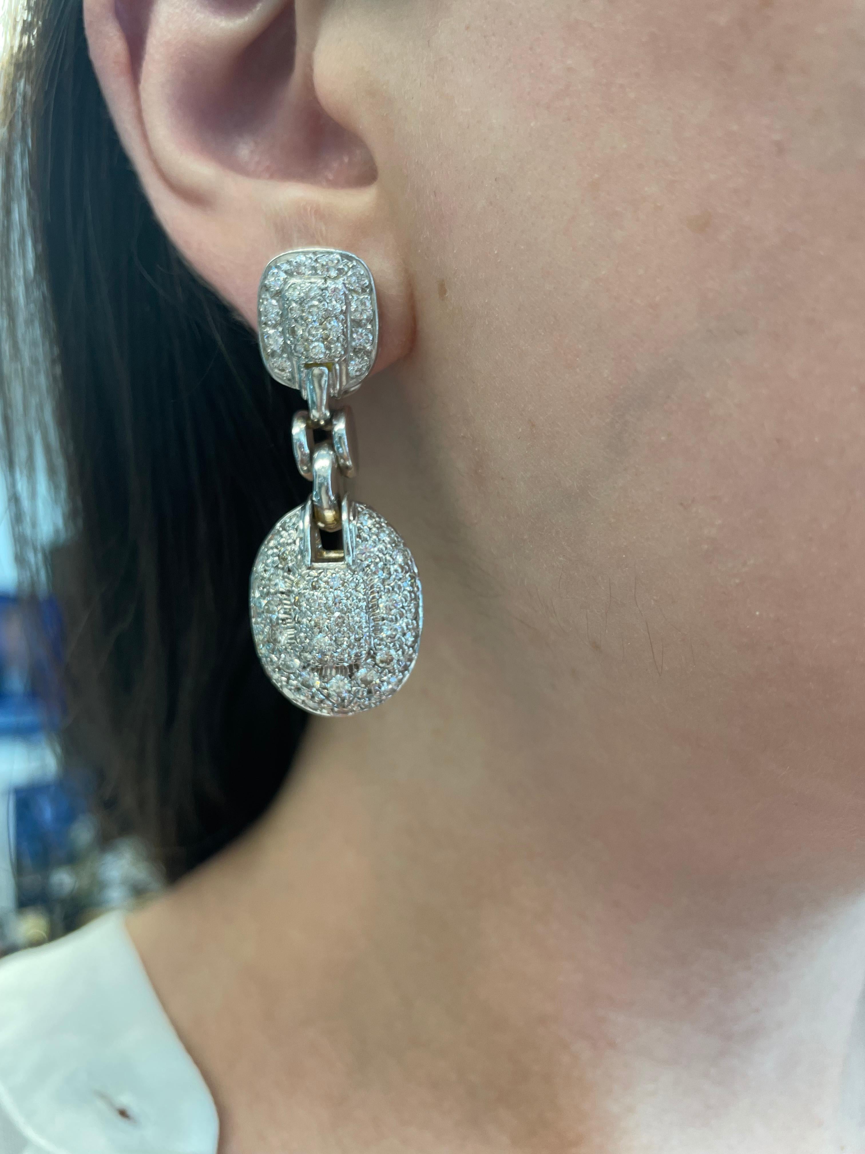 Grand pave set diamond earrings.
5.09ct of round brilliant diamonds, approximately H/I color grade and SI clarity grade diamonds. 18-karat white gold. 
Accommodated with an up to date appraisal by a GIA G.G. upon request. Please contact us with any