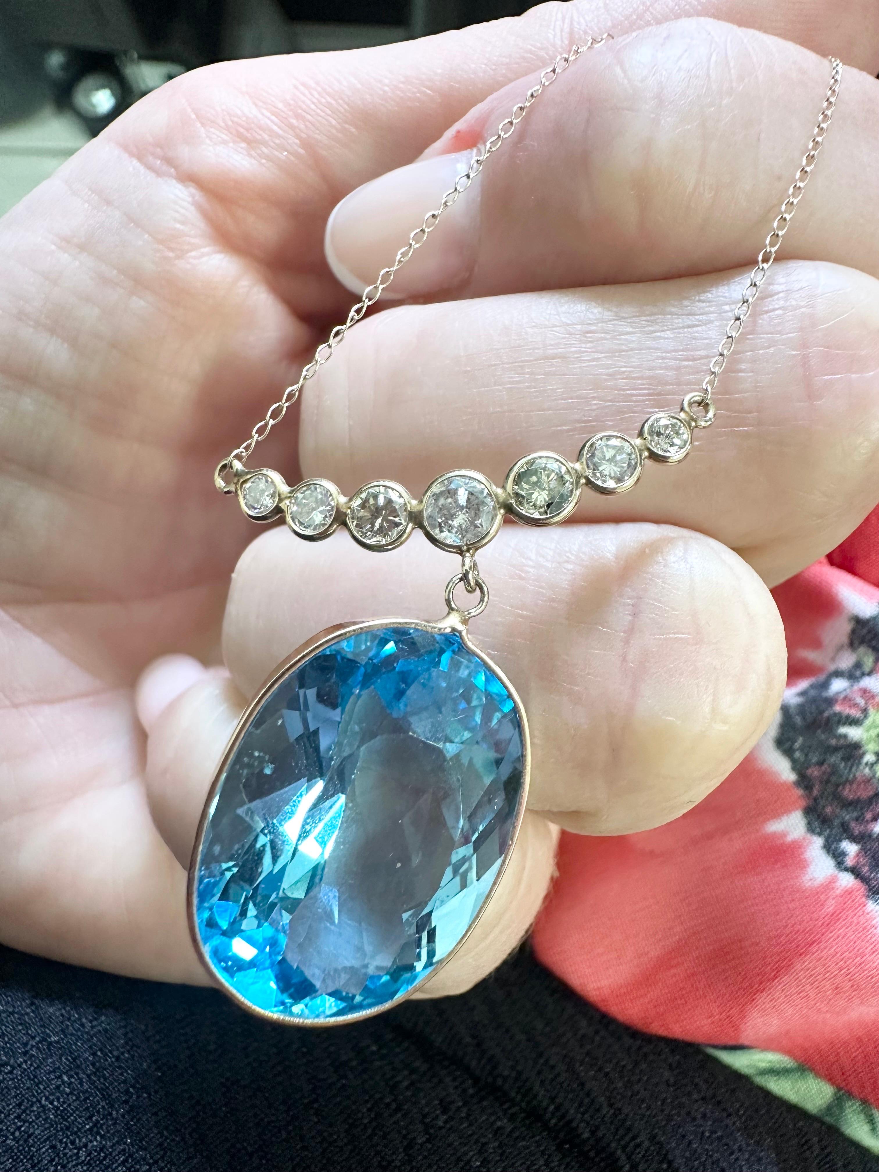 50 carats oval topaz and 1ct of champagne diamonds in this beautiful luxurious necklace made in 10KT yellow gold, ready to ship in 1 day!! 

Details:
Metal: 10kt yellow gold 
Gemstone weight: 50ct
Gemstone shape: Oval 
Gemstone clarity: Very