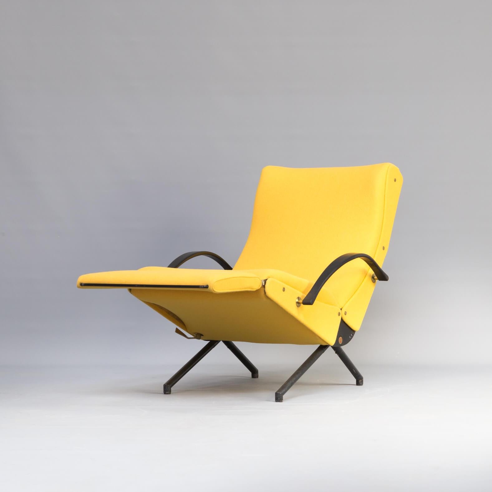 First edition P40 lounge chair by Osvaldo Borsani for Tecno. The first edition model has a round tubular base. The P40 lounge chair can be adjusted into different positions. The seat, back-and footrest can all be adjusted separate from each other.