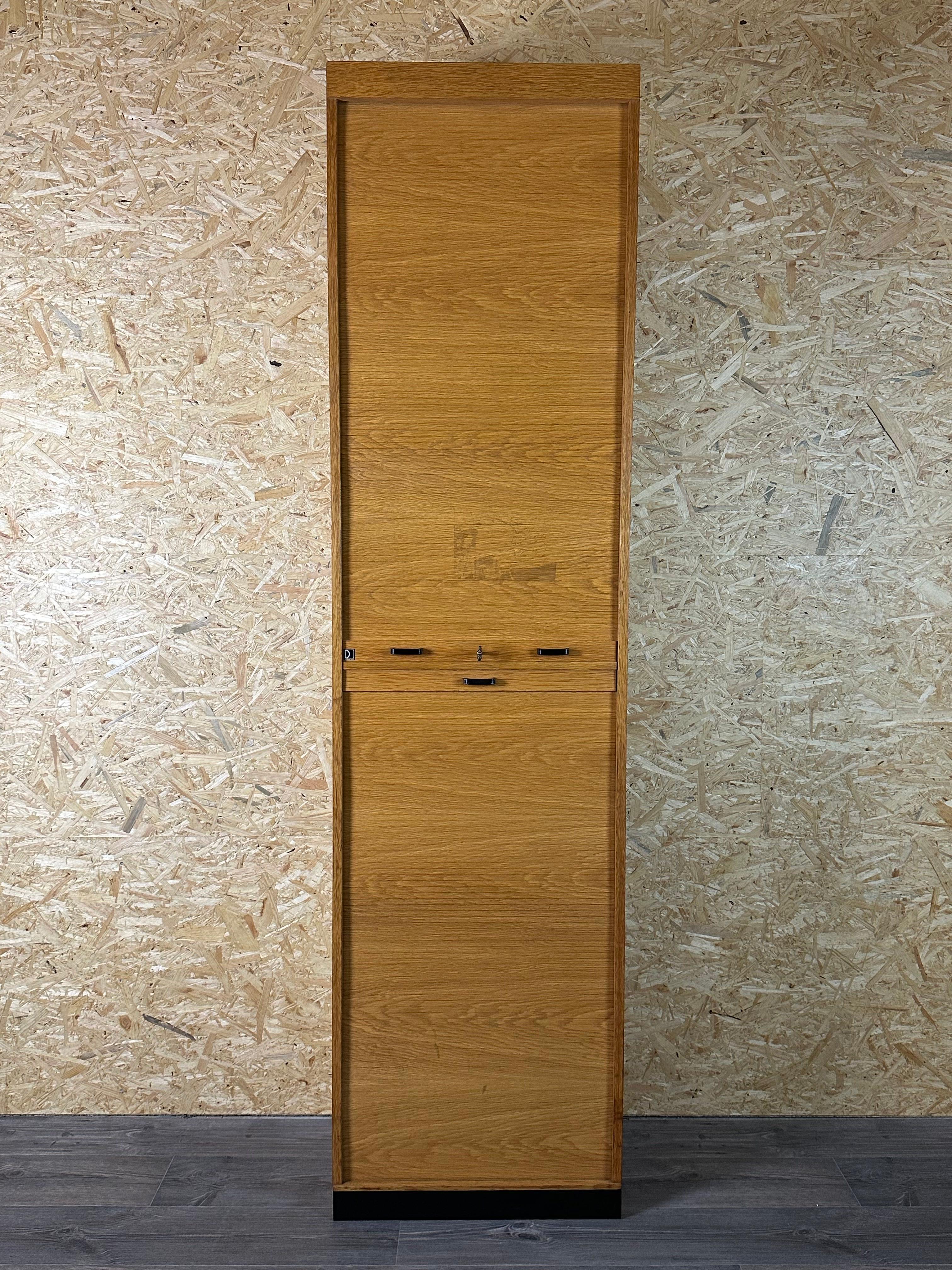50s 60s roller shutter cabinet office cabinet filing cabinet mid century design 

Object: roller shutter cabinet

Manufacturer: Dobergo

Condition: good-vintage

Age: around 1950-1960

Dimensions:

Width = 60cm
Depth = 40cm
Height = 230cm

Other