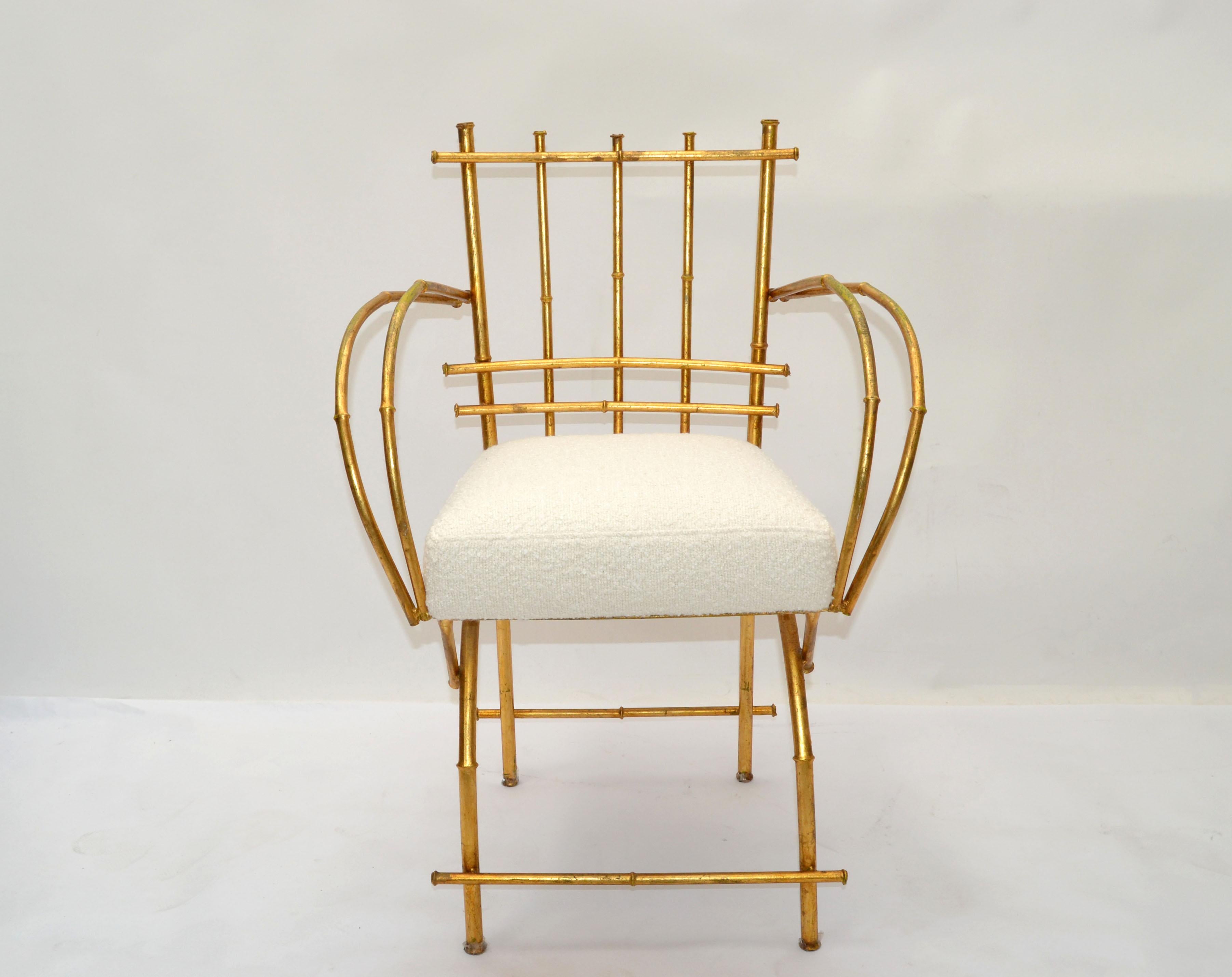 We offer a faux bamboo metal armchair or vanity chair in gold finish sculptural crafted and has a new upholstered seat cushion in a cream color bouclé fabric.
Made in America in the 1950.
Ready to use with some wear to the gilt paint due to