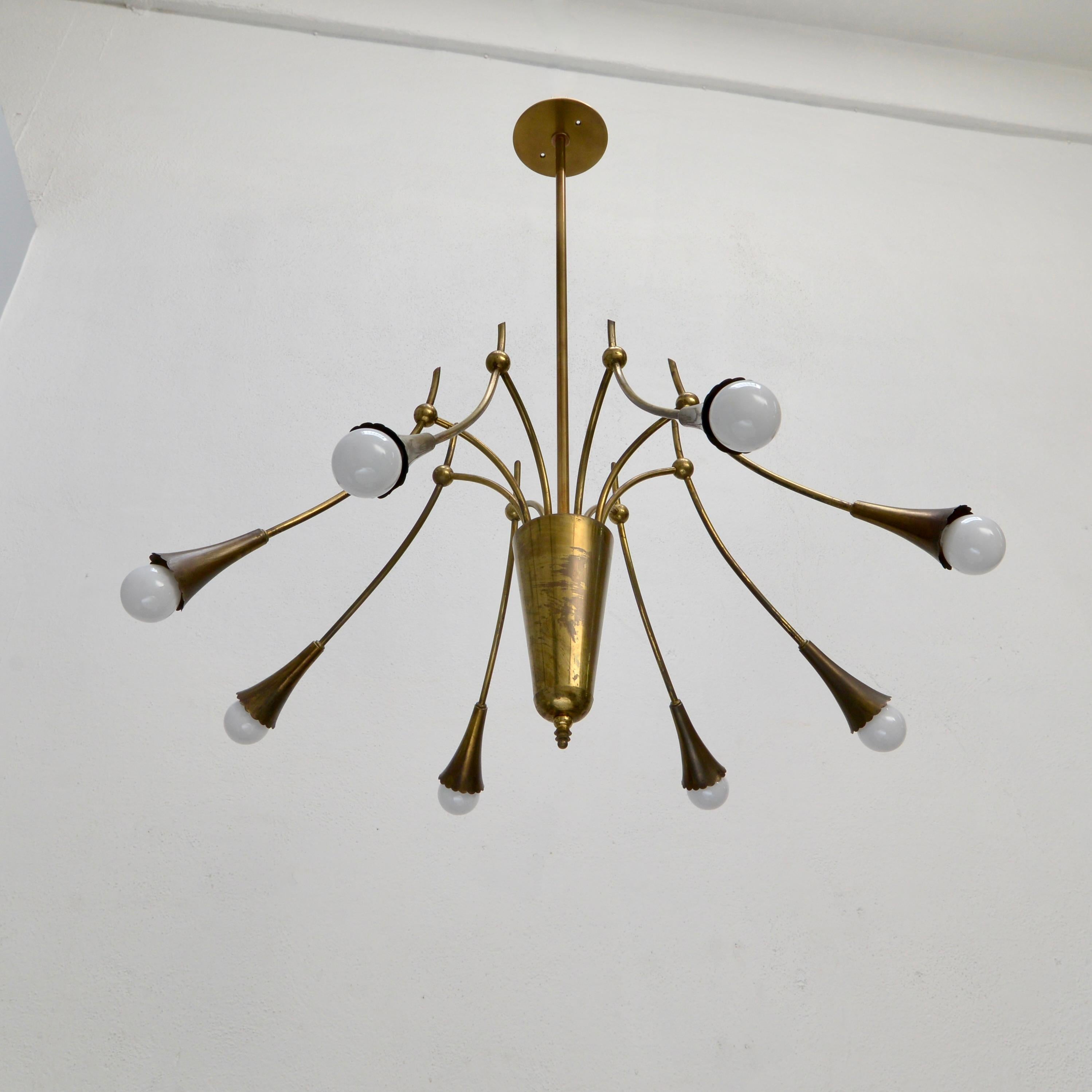 Of the period mid century Italian 8 shade 1950s Botanical chandelier. Fabricated in naturally aged brass of many years. Wired with 8-E12 candelabra based sockets. Wired for use in the US. Light bulbs included with order.
Measurements:
OAD: 34”