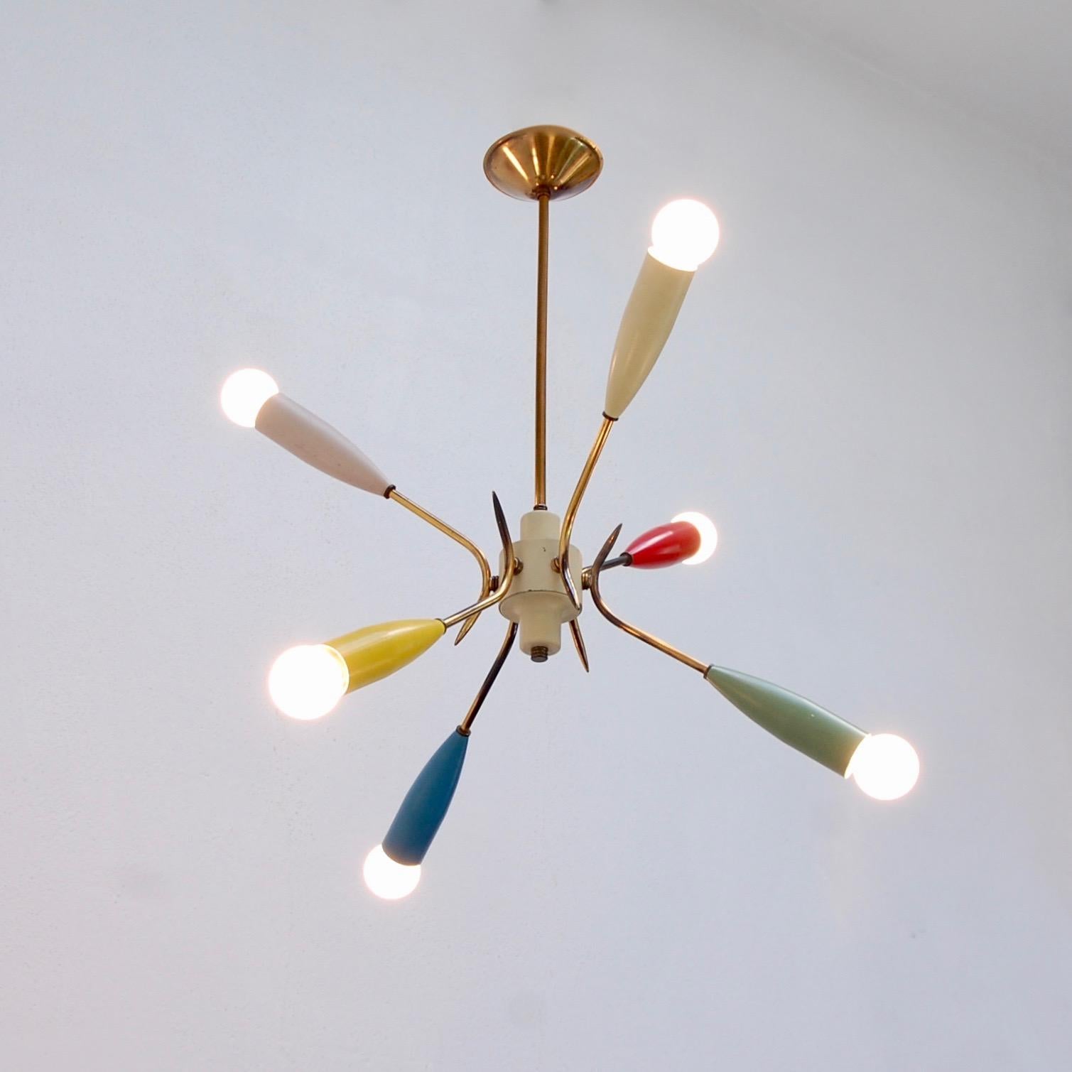 1950s colorful Sputnik chandelier from Italy. Partially restored, with original paint and brass finish. Rewired for use in the US with six E12 candelabra based sockets. Light bulbs included with purchase.
Measurements:
Diameter 23”
OAD: