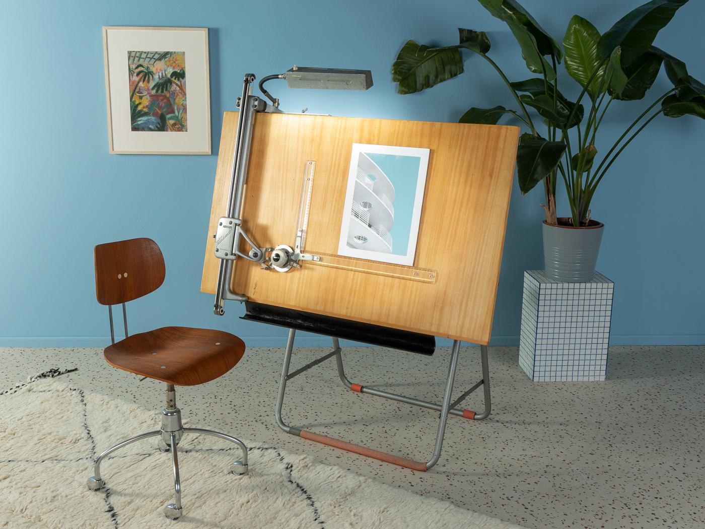 Unique architect’s drawing table from the 1950s. Very high quality cast iron construction with a drawing table and the original lamp. The frame is height adjustable and the table can be tilted. Made in Germany, manufacturer: Nestler (branding on the