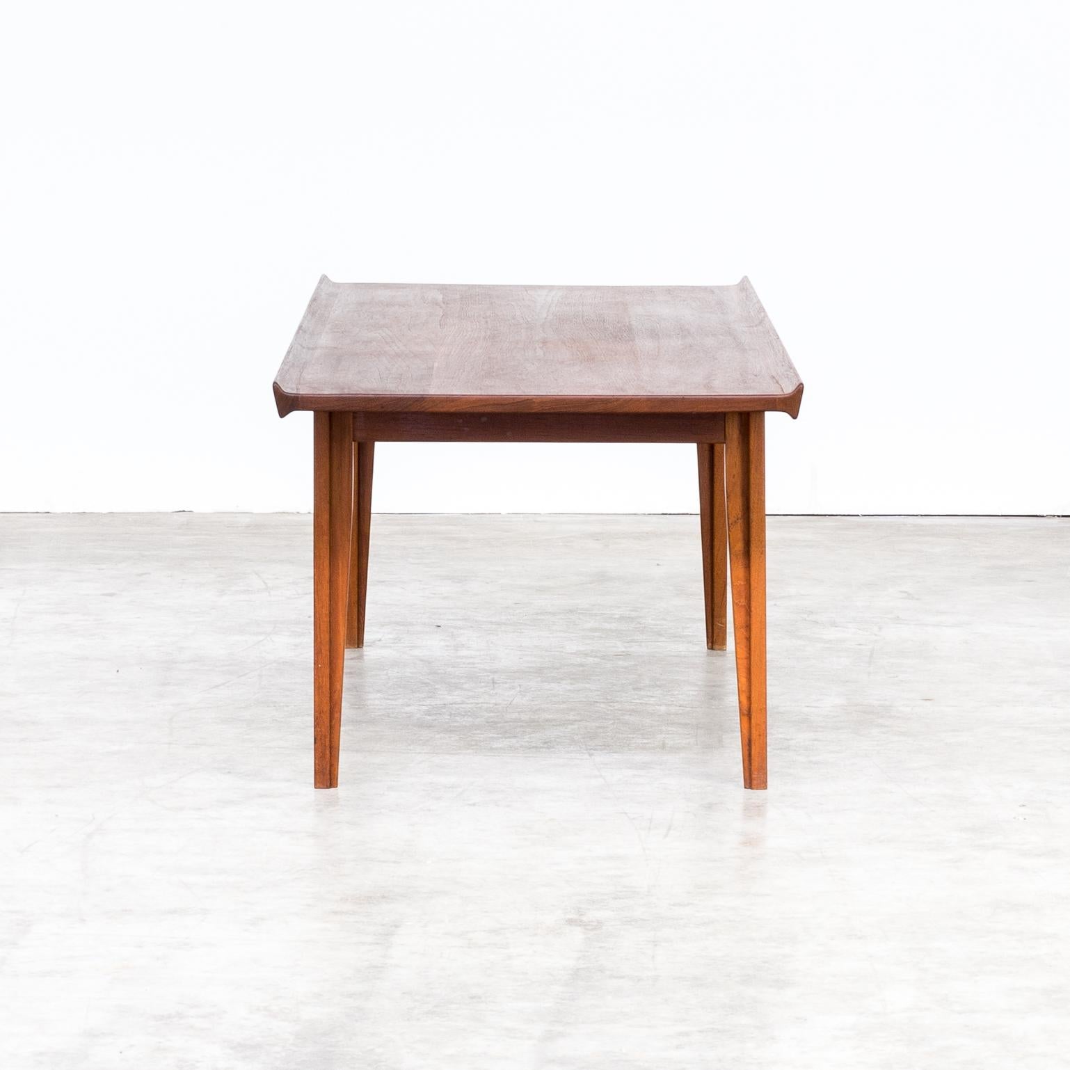 1950s Finn Juhl FD532 teak coffee table for France & Son. Beautiful Finn Juhl coffee table, understated but complicated in the detail. The solid teak top is wonderfully sculptured along the long sides whilst the legs are made of two individual