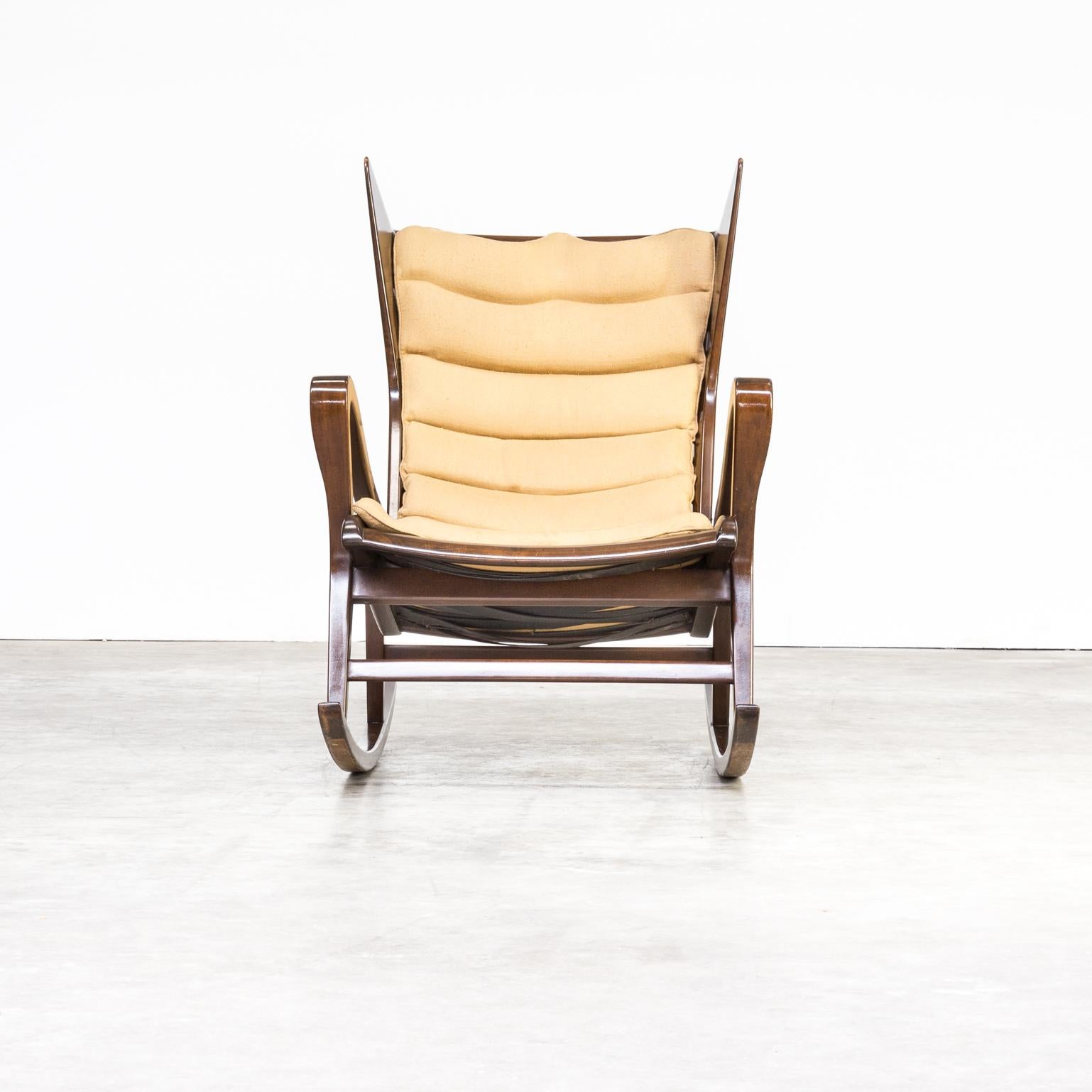 An very rare rocking chair attributed to Gio Ponti in walnut, leather singles and fabric for Cassina, Italy, 1950s. Exquisite production techniques used which are shown by the beautiful wooden details throughout the whole design. Original upholstery