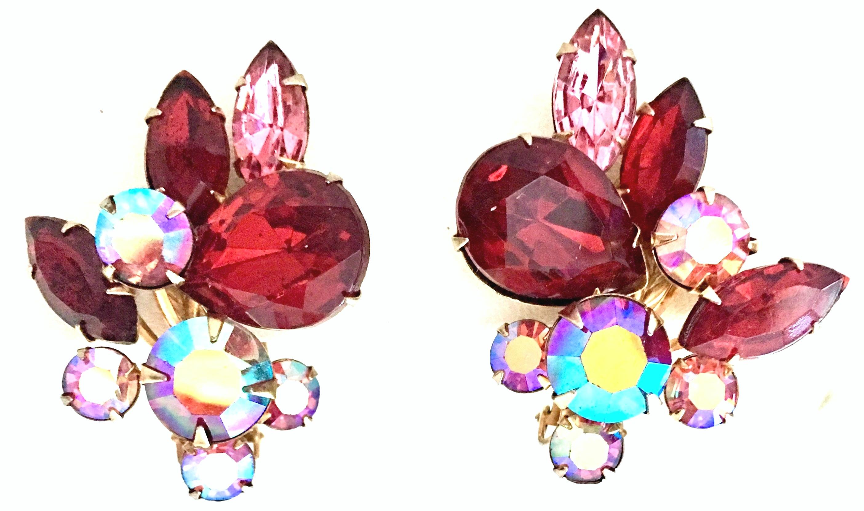 1950'S Gold Plate & Swarovski Crystal Rhinestone Earrings By, Beaujewels. These brilliant and dimensional prong set abstract earrings feature, ruby, pink and aurora borealis crystal rhinestones. This clip style pair of earrings are designed with a
