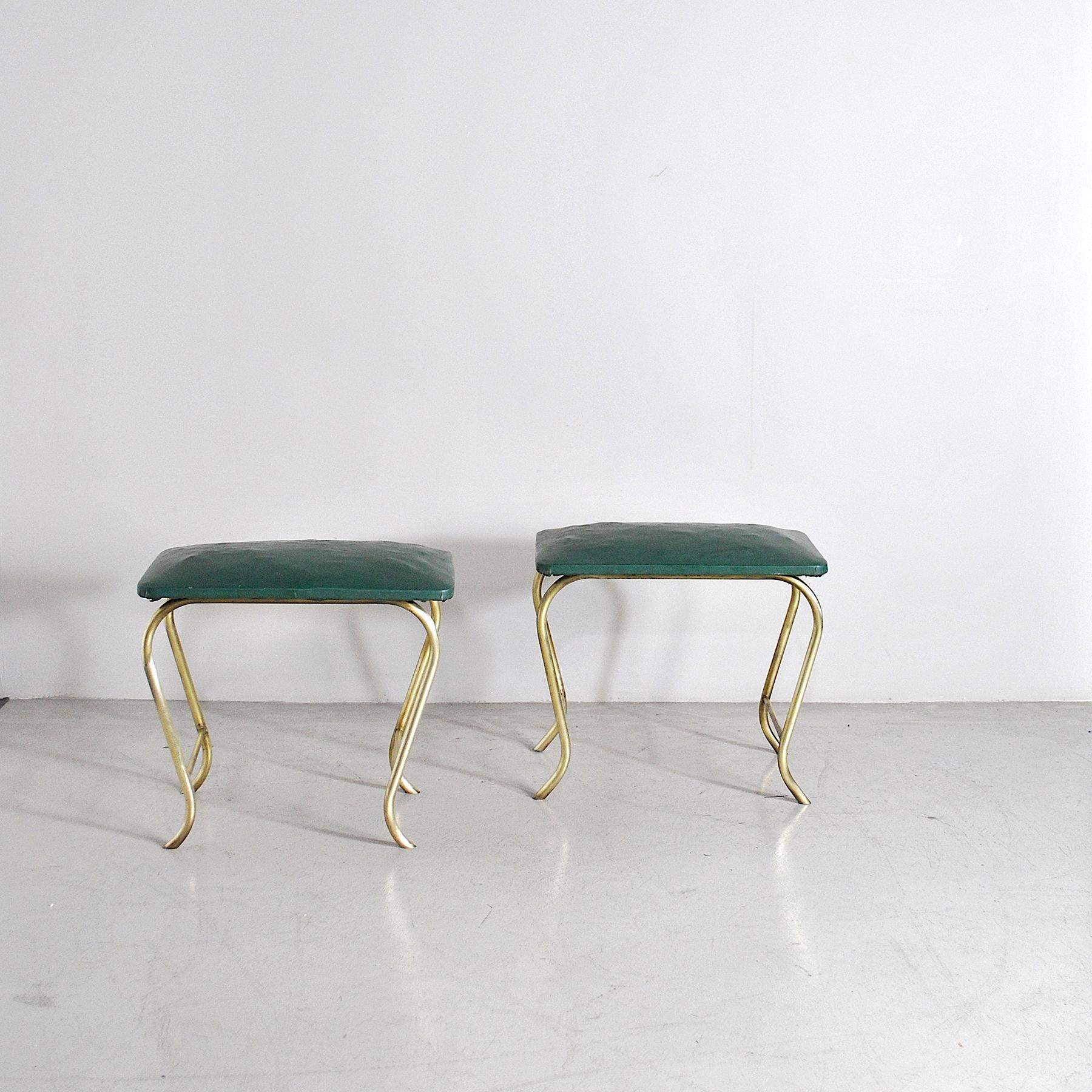 Pair of stools made in Italy from the 1960s, curved tubular structure in brass, seat in original vintage vinyl.