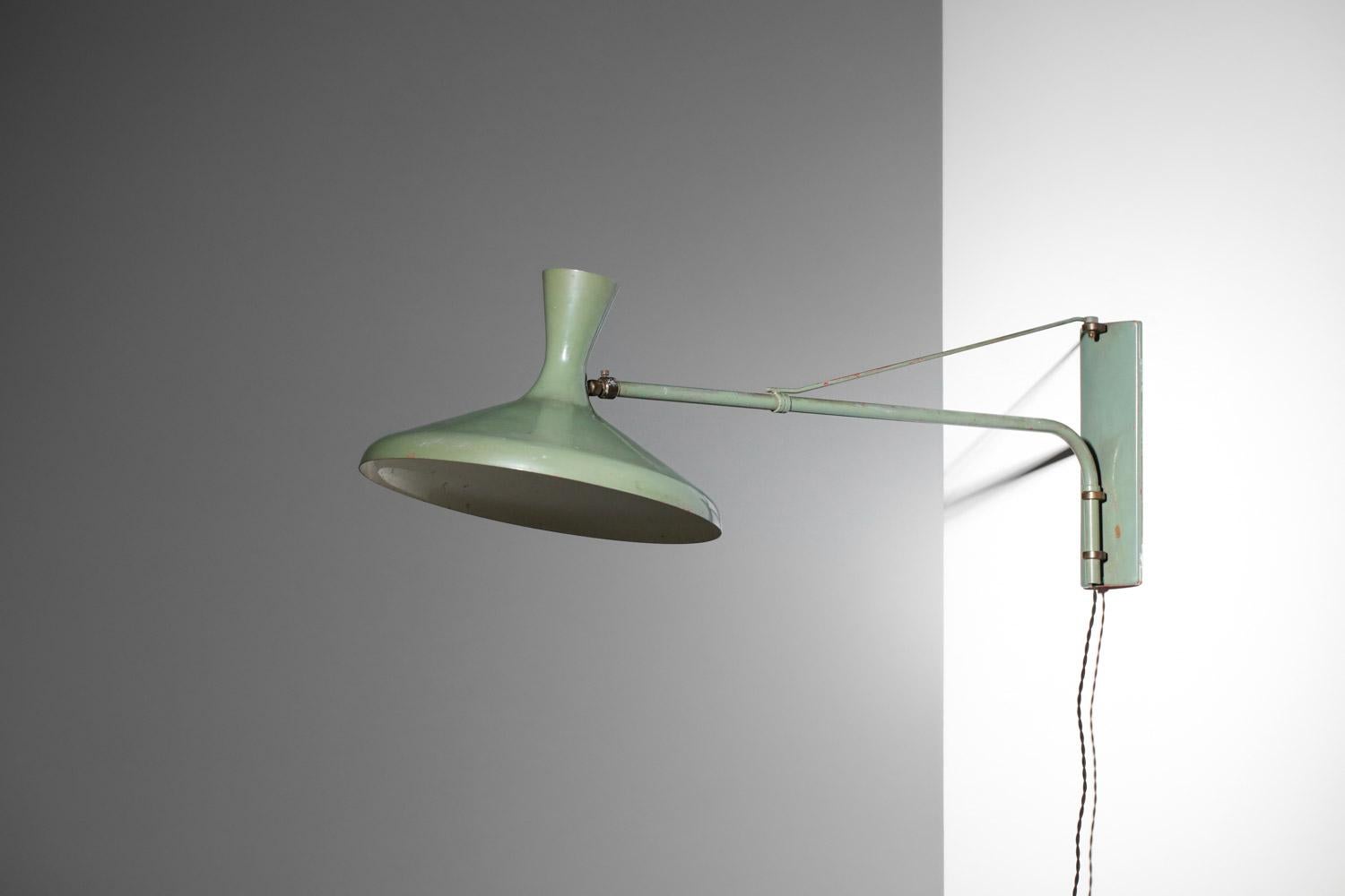 Italian industrial style bracket from the 50s. Structure of wall lamp and shade in lacquered metal (originally painted and re-lacquered in the past).  The lampshade can be rotated into different positions thanks to the central ball-and-socket joint.