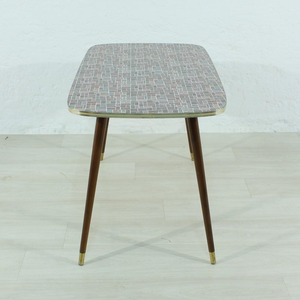 Plastic-coated tabletop
wood and brass
legroom: 60cm.