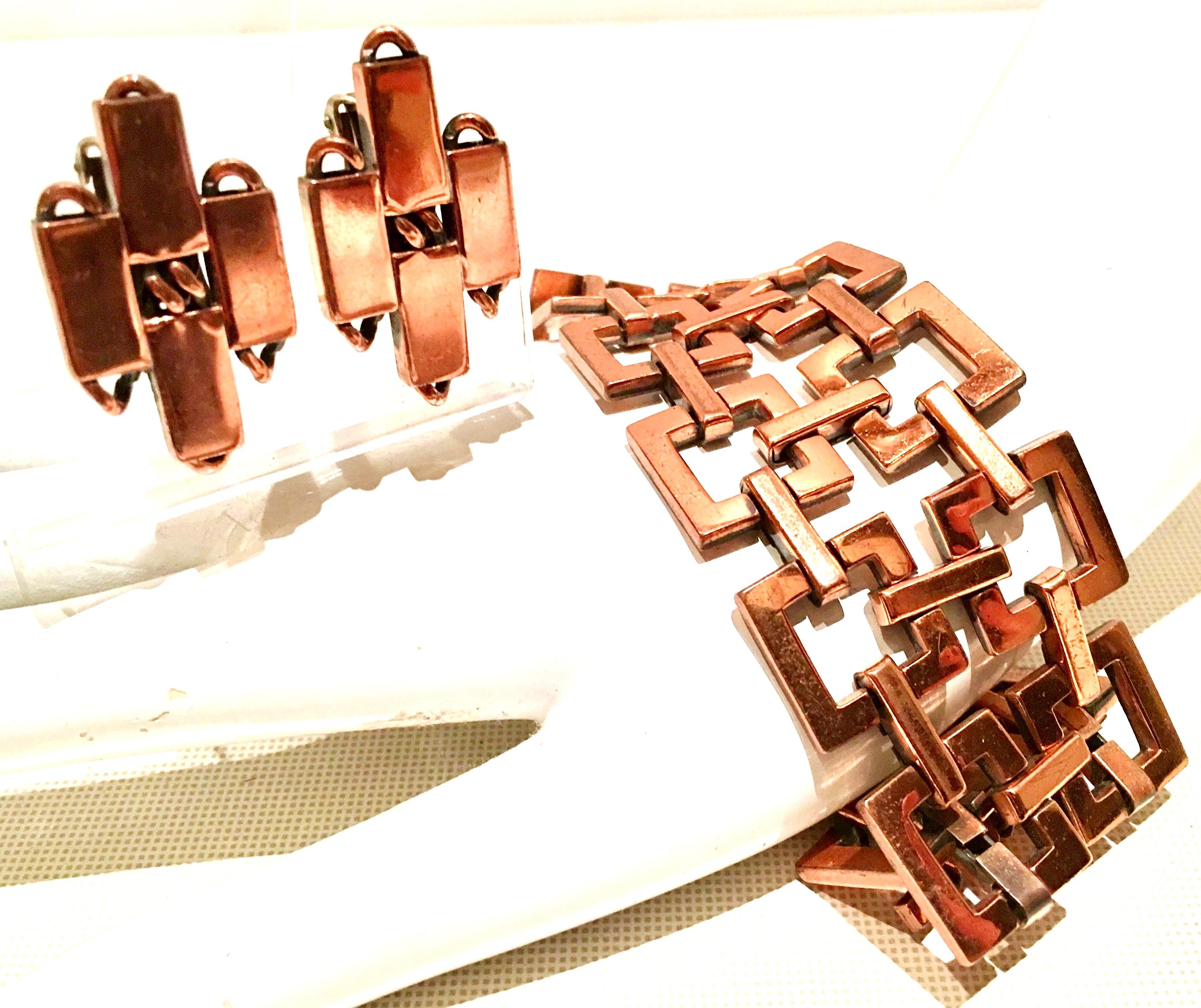  1950'S Matisse Renoir copper modernist geometric chain link bracelet and earring, three piece set. What makes these Mid-Century Era designed pieces current today is the 