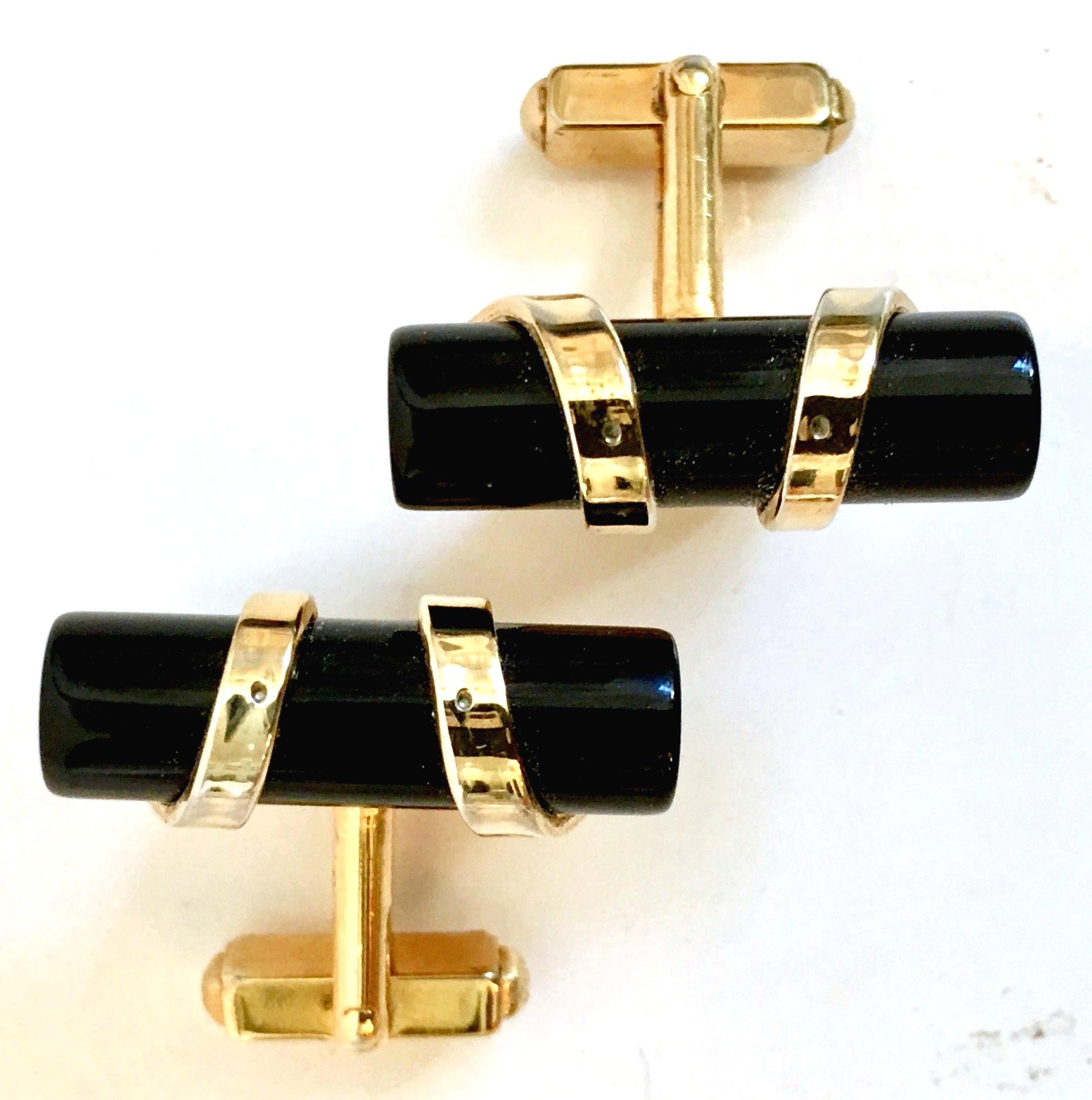 1950'S Art Deco style tubular authentic onyx wrapped in 12K gold cuff links by, Anson.
These vintage cuff links are signed, Anson.