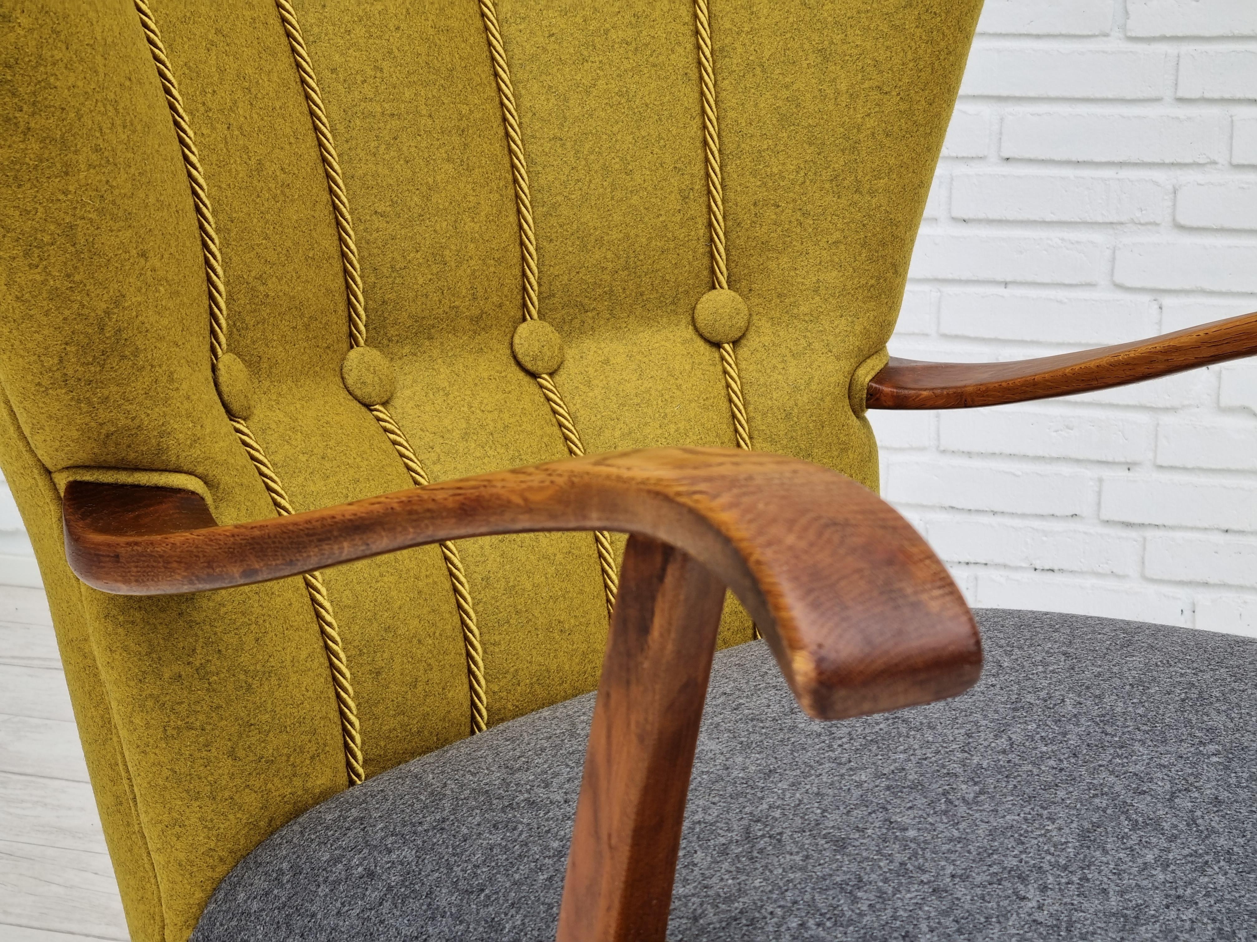 Danish design, 50s. Refurbished, reupholstered relax armchair. Quality felt-like furniture wool fabric in two different colors: carry yellow and gray. Color combination right after original design from 1955-60. Legs and armrests of oak wood.