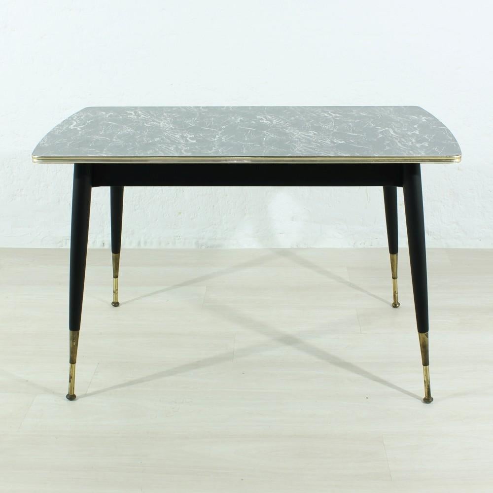 Material: Brass, wood, plastic coating.
Wood on the feet was repainted black.
The maximum height of the table is 71cm. The table can be lowered by means of a crank to a minimum height of 62cm (see photos).