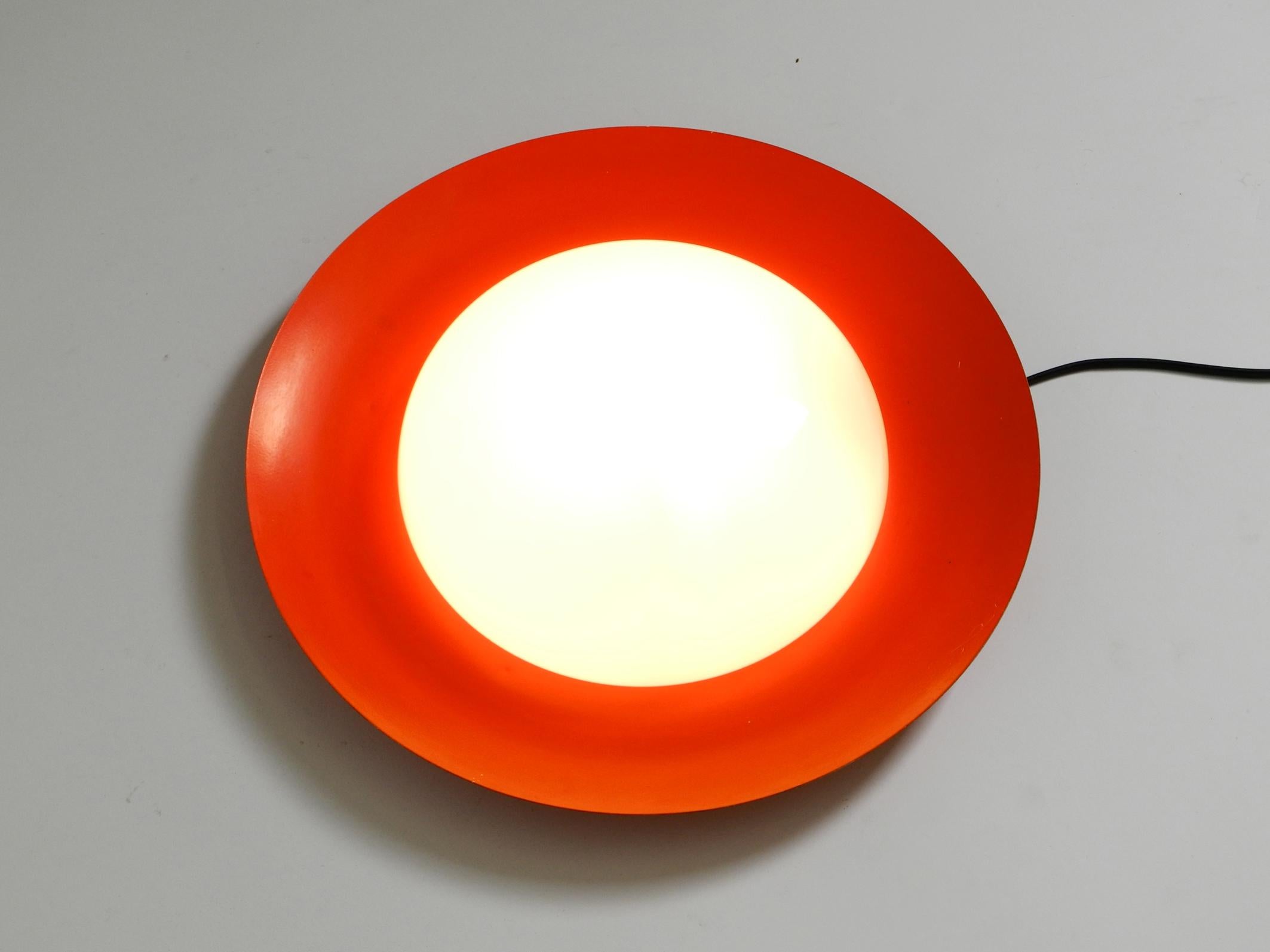 German 50s wall or ceiling lamp made of glass with metal reflector from Kaiser Leuchten For Sale