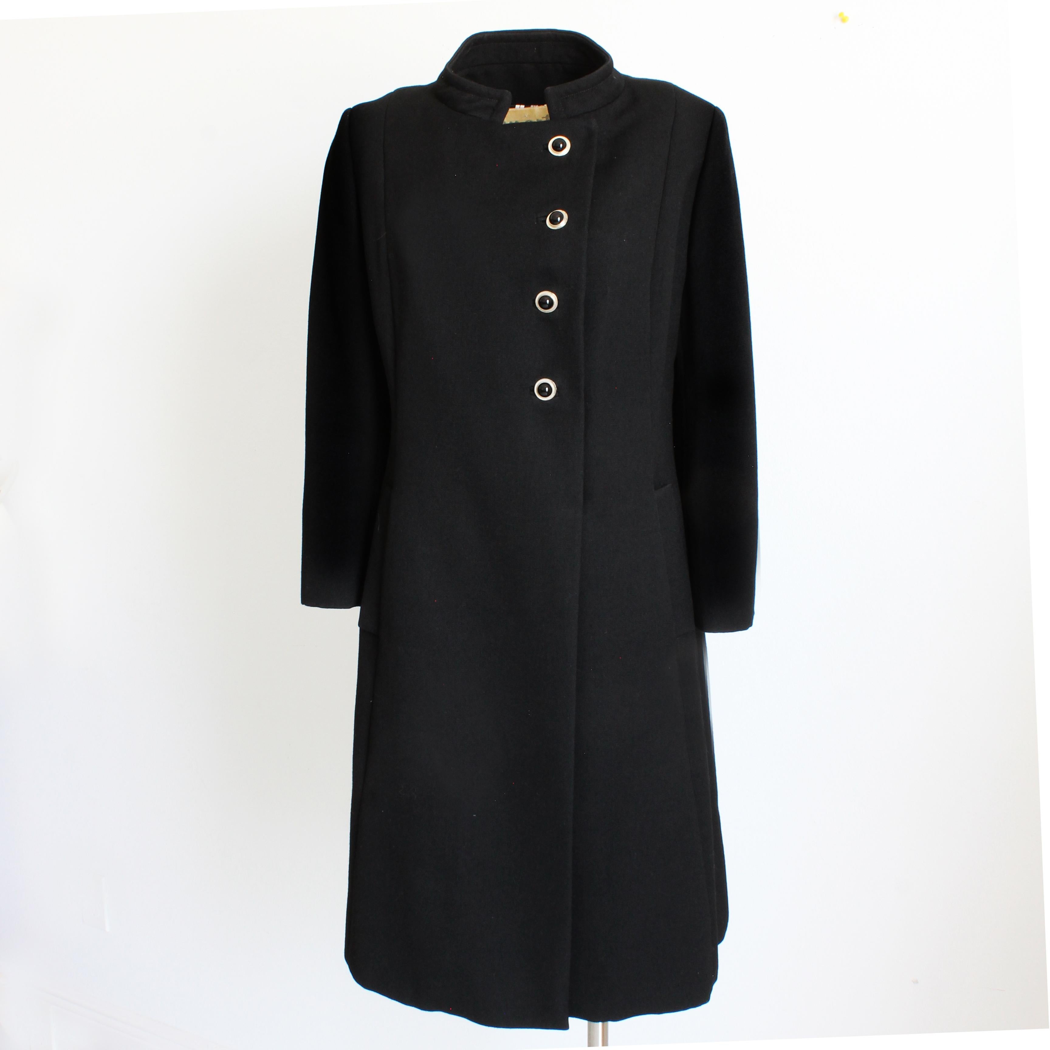 Vintage military style virgin wool coat, made by Zelinka Matlick and sold by high end apparel store Martins of Brooklyn, most likely in the mid 50s. Made from black virgin wool, the tailoring is downright amazing on this coat! It fastens with black