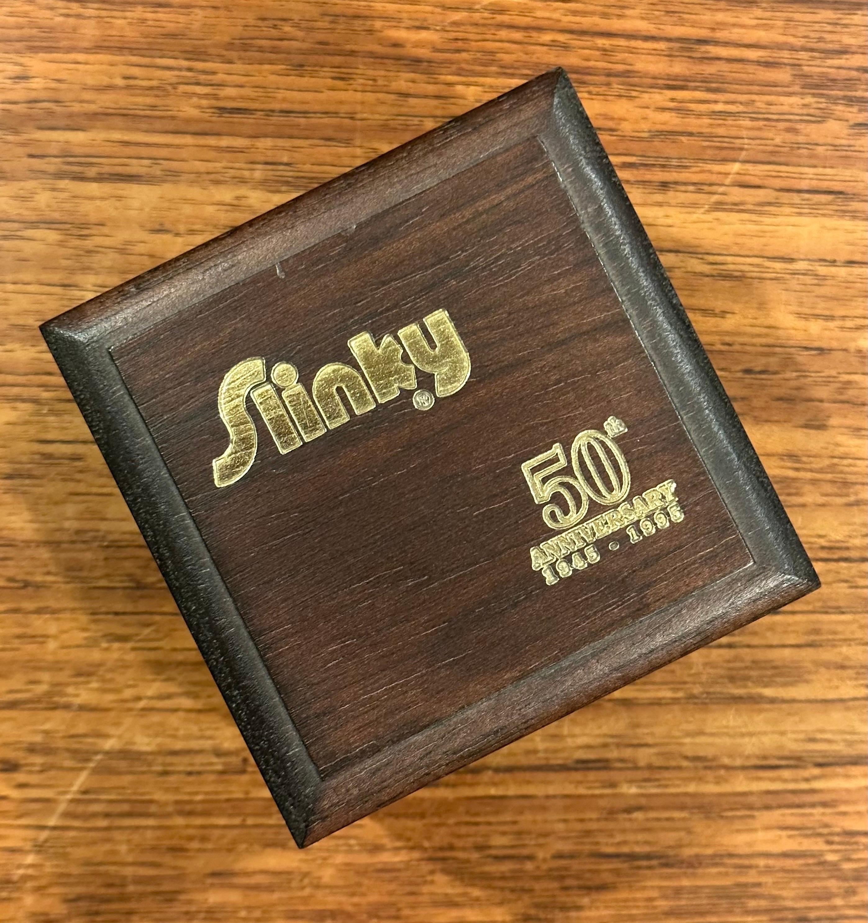 American 50th Anniversary Gold-Plated Slinky Toy in Wood Box For Sale