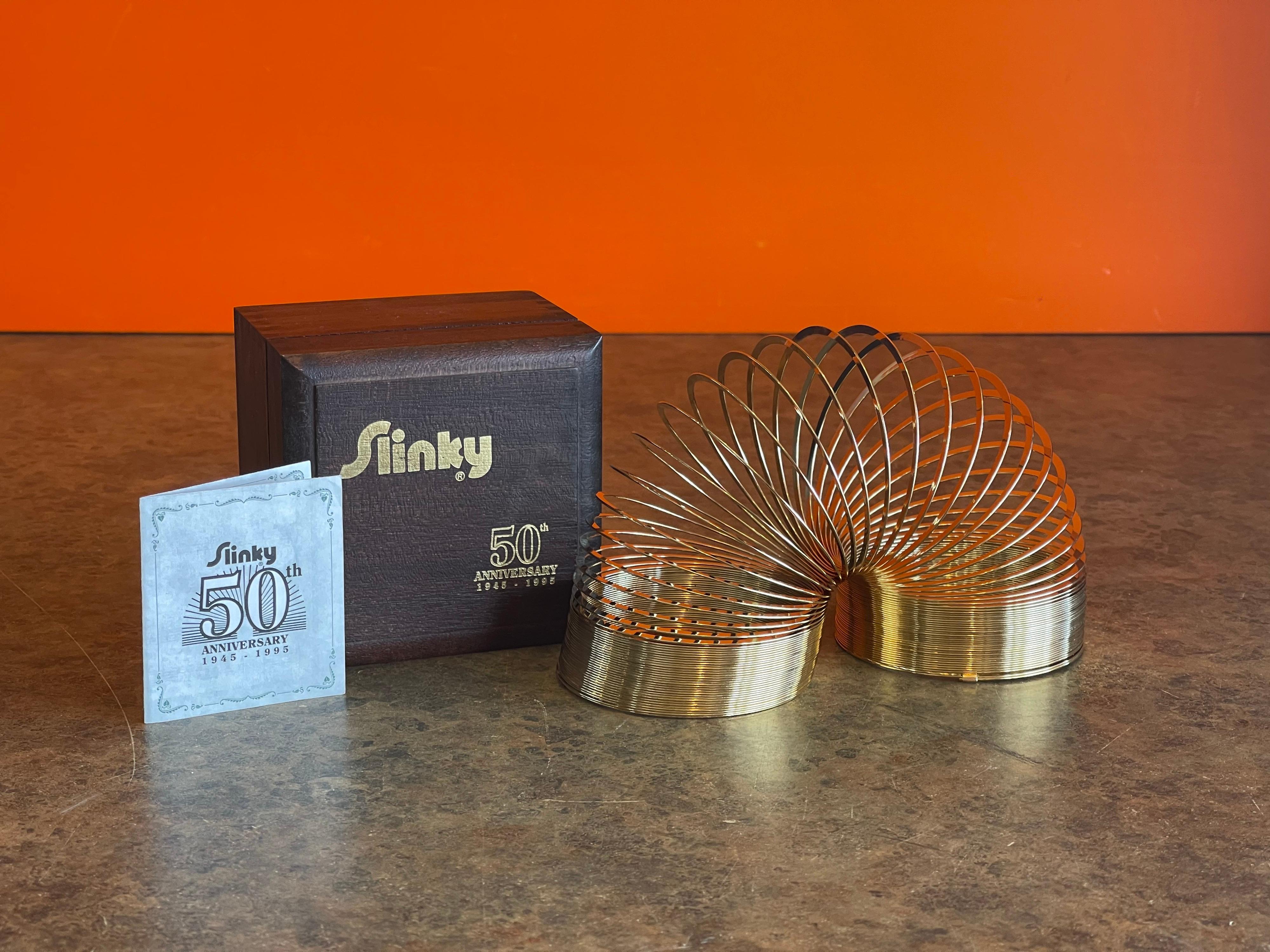 Brass 50th Anniversary Gold-Plated Slinky Toy in Wood Box