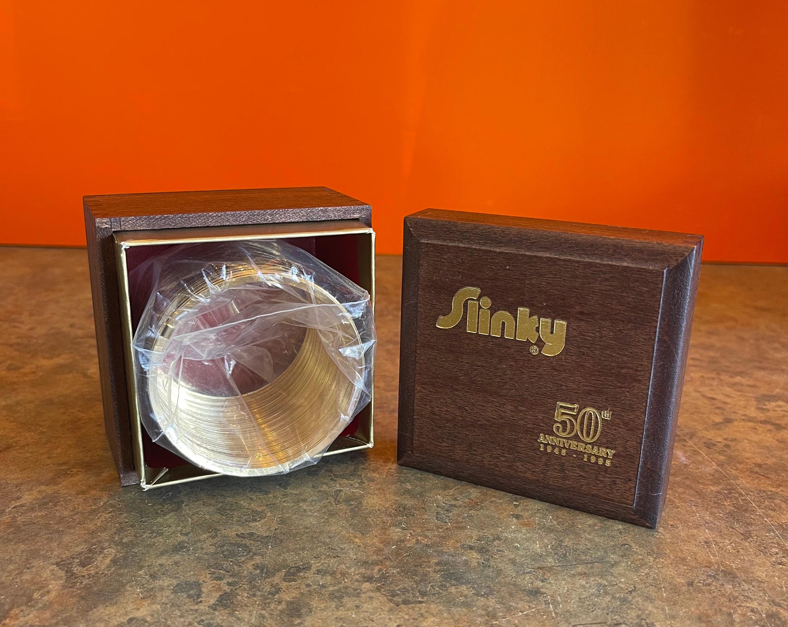Gold Plate 50th Anniversary Gold-Plated Slinky Toy in Wood Box, New Condition