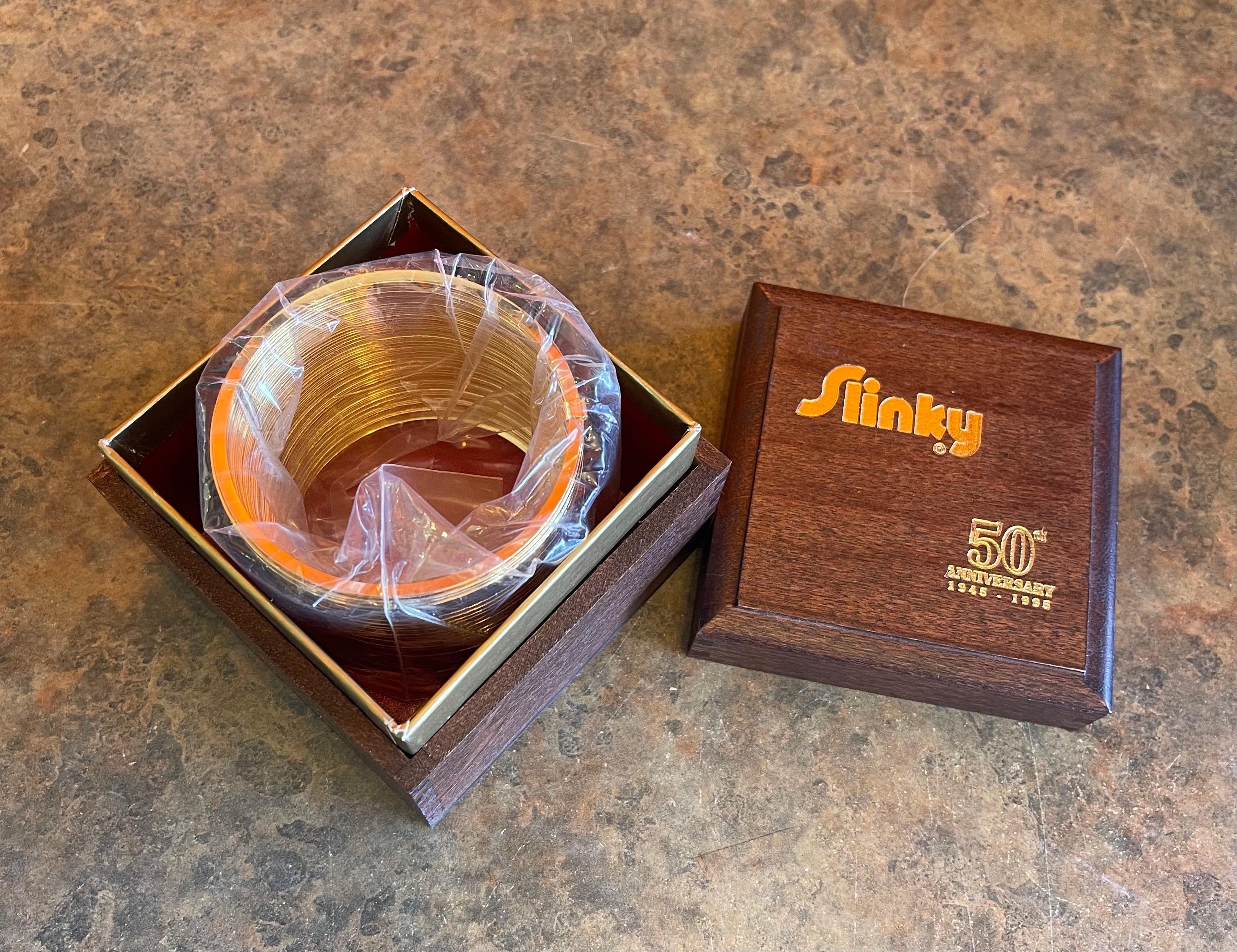 50th Anniversary Gold-Plated Slinky Toy in Wood Box, New Condition 1
