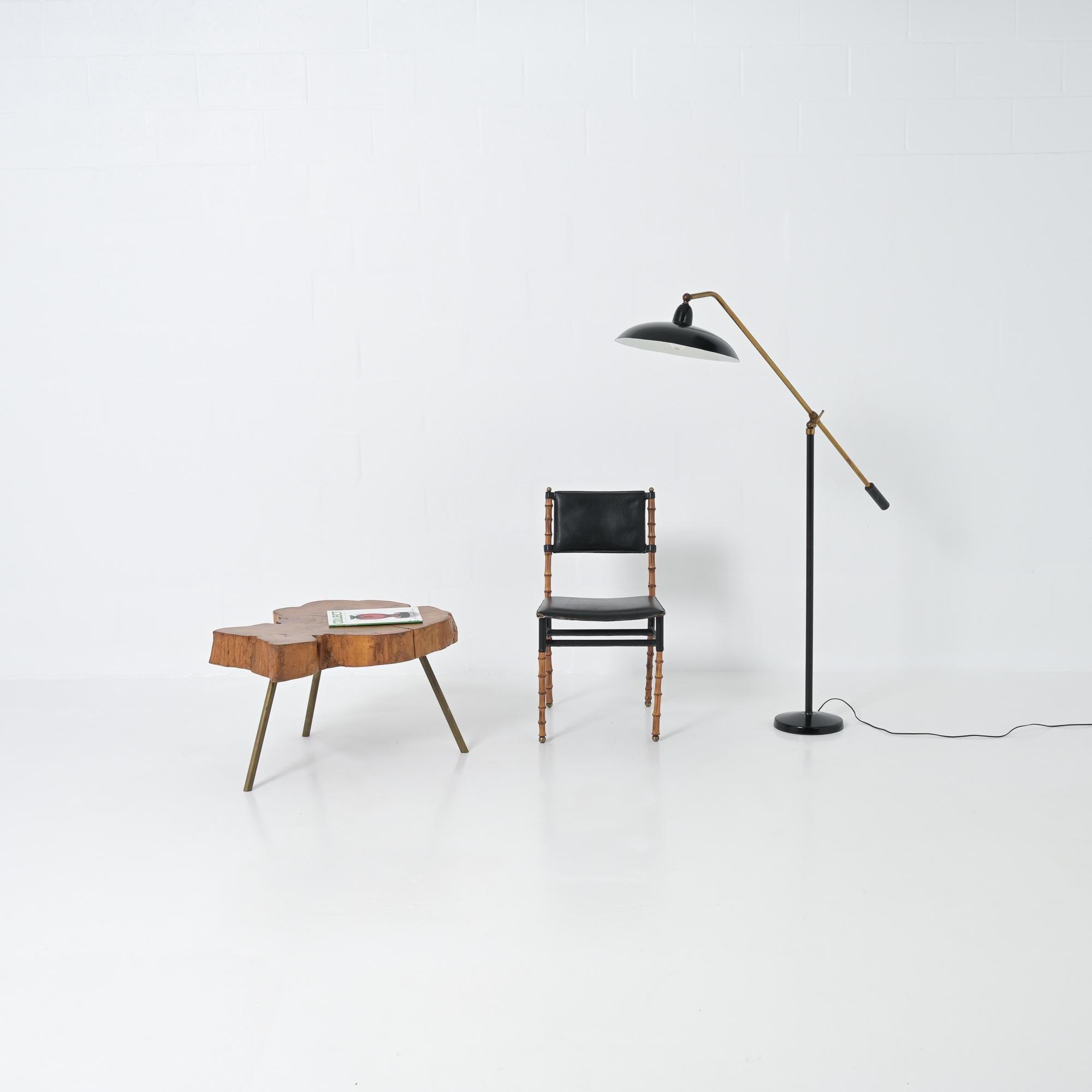 We attribute this beautiful floor lamp to Arredoluce. The plug is marked AL and the style of the lamp fits the style of the Arredoluce lamps. The copper stems are beautiful patinated. There is a switch in the shade. The shade and floor cover are