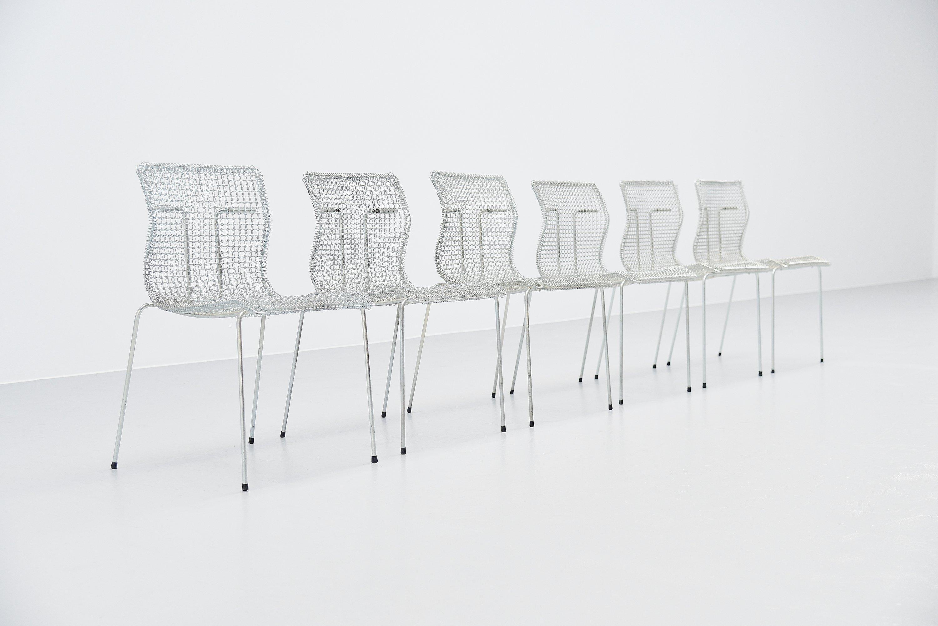 Set of so called 'Rascal' chairs designed by Niall O'Flynn and manufactured by 't Spectrum, Holland 1997. These chairs have a galvanized steel frame and spring seats. They look not comfortable, its everyone's first thought but they seat surprisingly