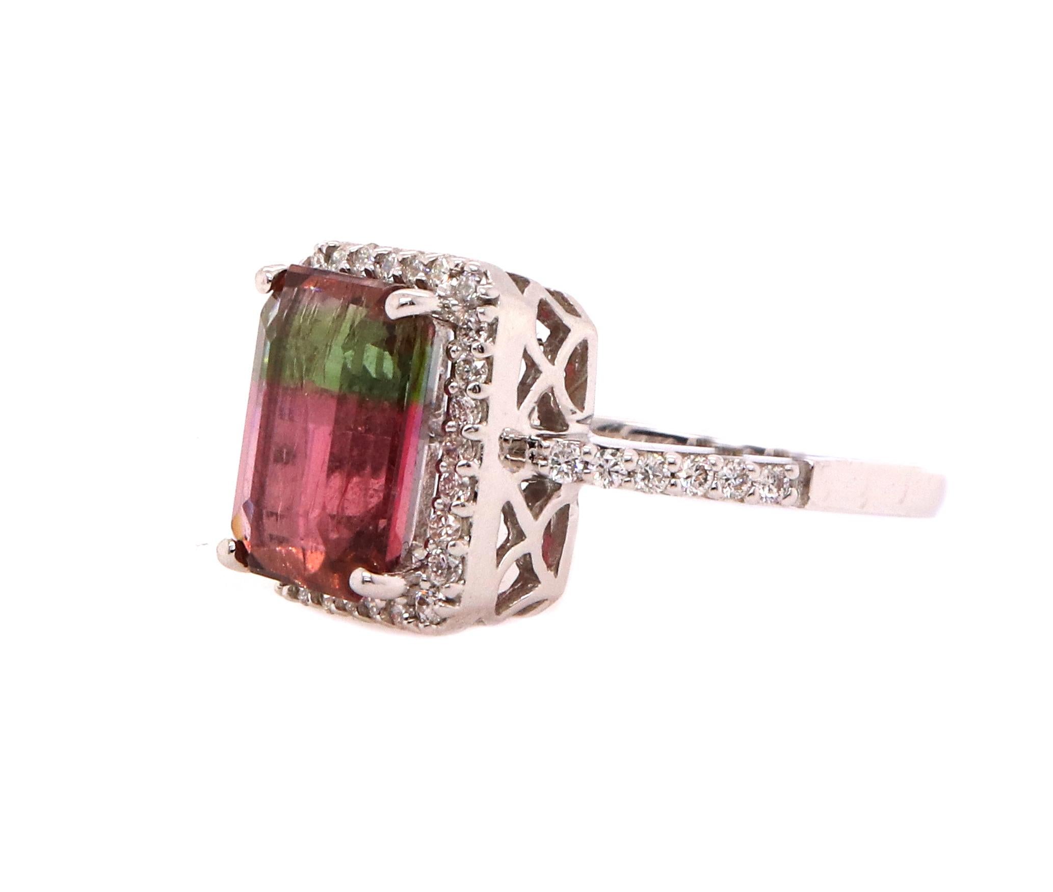 Material: 14K White Gold
Center Stone Details: 1 Emerald Cut Bicolored Tourmaline at 5.1 Carats - Measuring 11.15 x 9.2 mm
Diamond Details: 40 Brilliant Round White Diamonds at 0.45 Carats. SI Clarity/H-I Color
Complimentary sizing on all Alberto