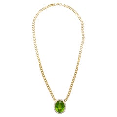 Ciondolo con peridoto verde da 51 carati e diamante aureolato con catena cubana in oro 18 carati