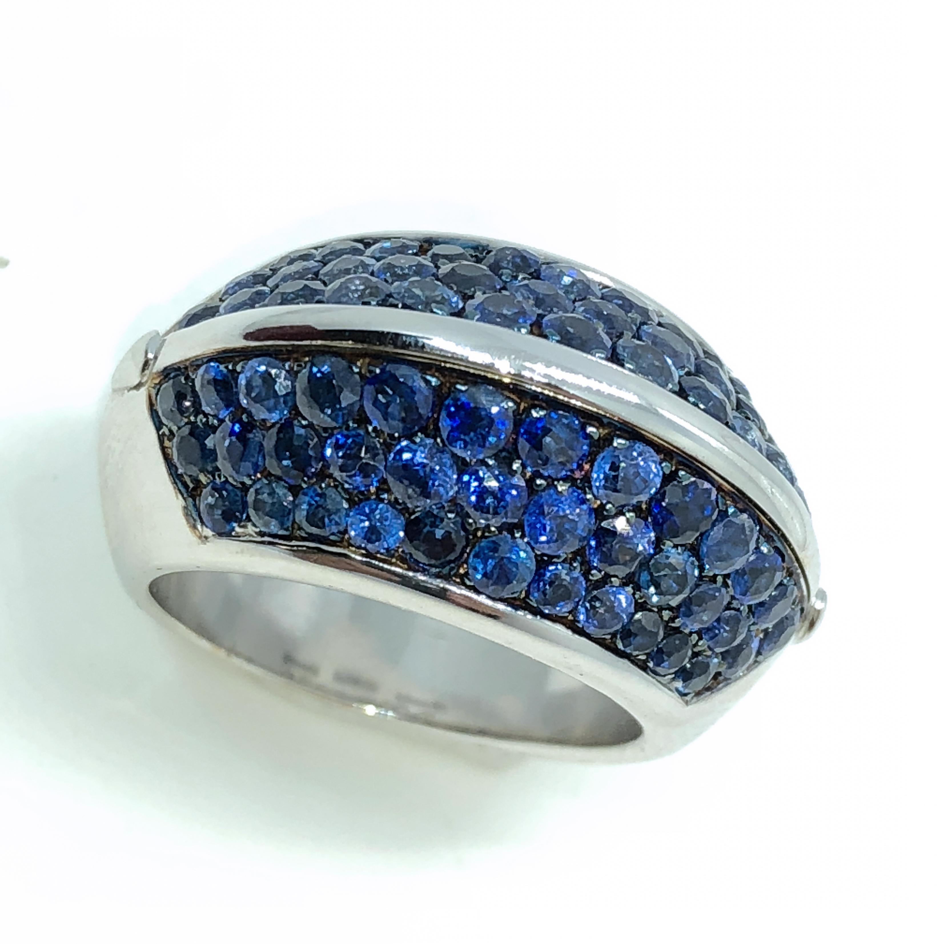 One-of-a-kind, unique yet timeless Pyramid Shaped Cocktail Ring Featuring 5.10 Carat Natural Blue Sapphire in an 18K White and Black Gold Setting: the magic of blue sapphires pavé is enhanced by glittering black gold.
In our fitted suede dark brown