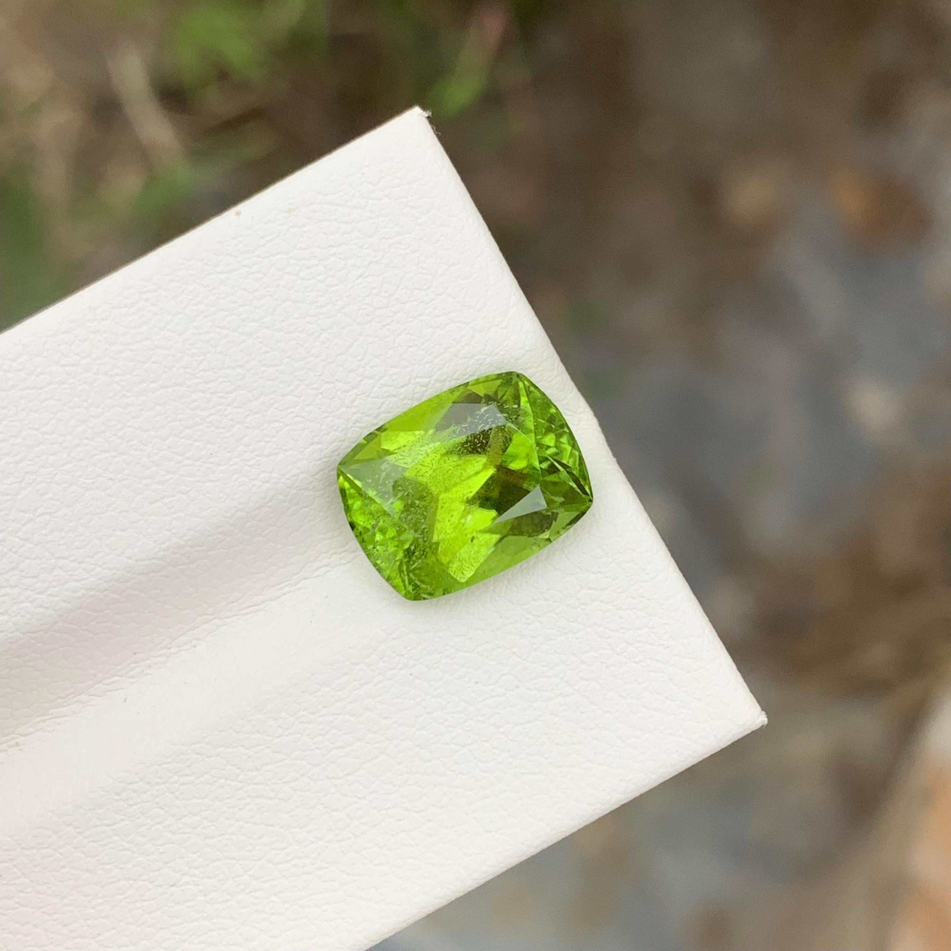 Women's or Men's 5.10 Carat Natural Loose Apple Green Peridot Cushion Shape Gem For Earth Mine  For Sale