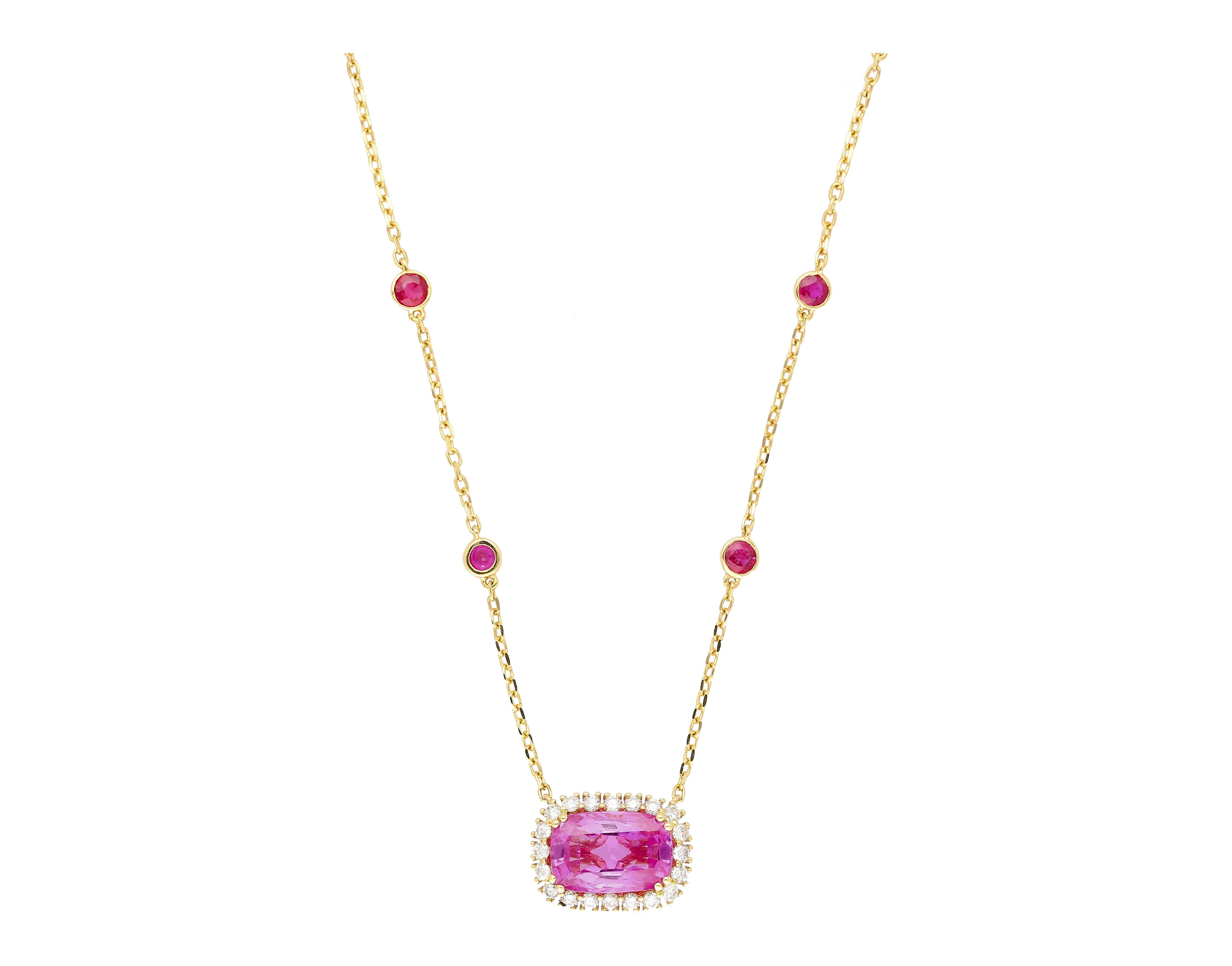 GRS certified 5.10 carat no heat cushion cut Ceylon origin pink sapphire necklace. The pink sapphire is prong set in 18k yellow gold and encompassed by 20 round cut diamonds that total 0.46 carats. On the chain of the necklace are 8 round cut rubies