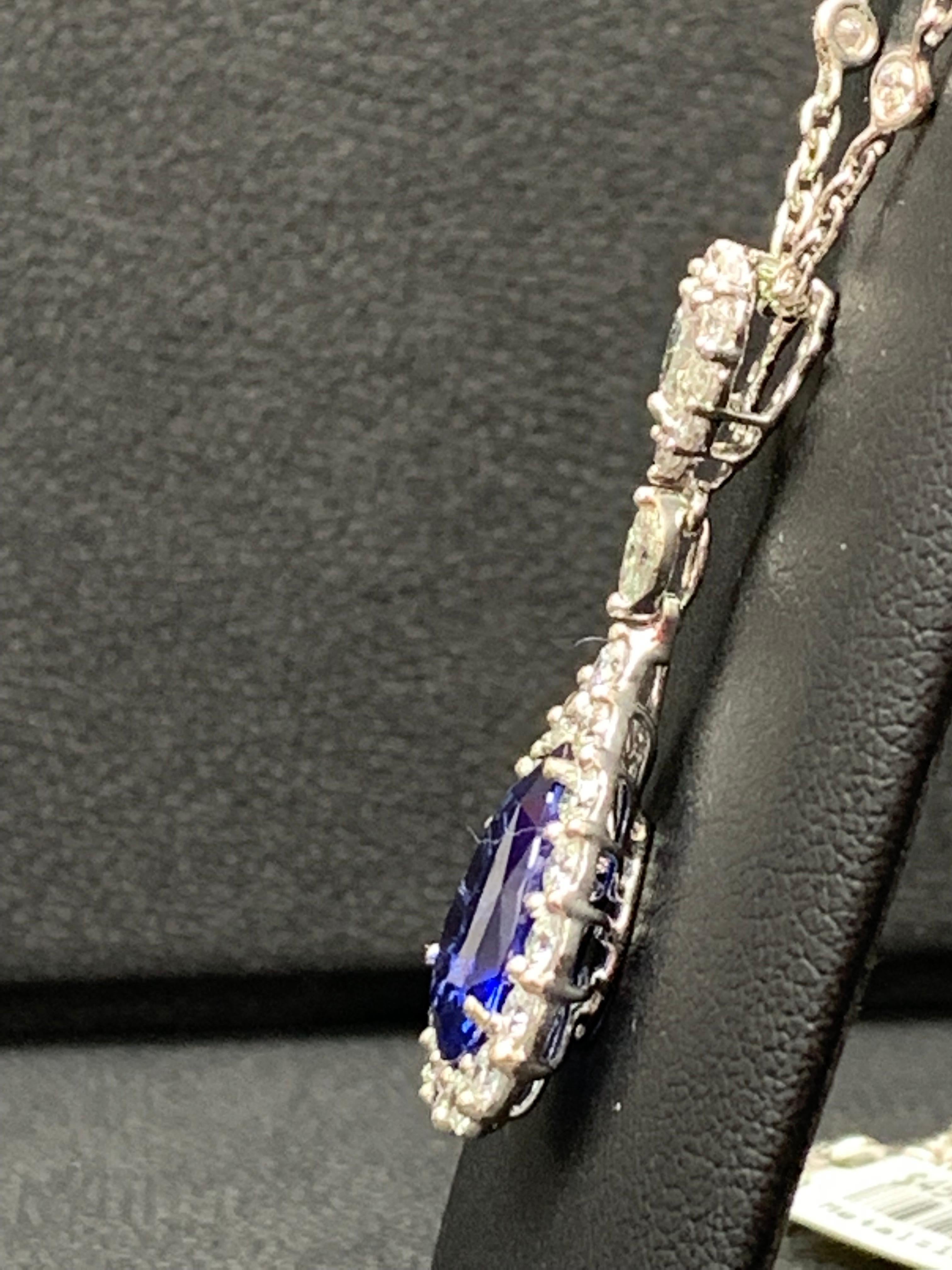 Pear Cut 5.10 Carat Pear Shape Blue Saphire and Diamond Halo Drop Pendant Necklace For Sale