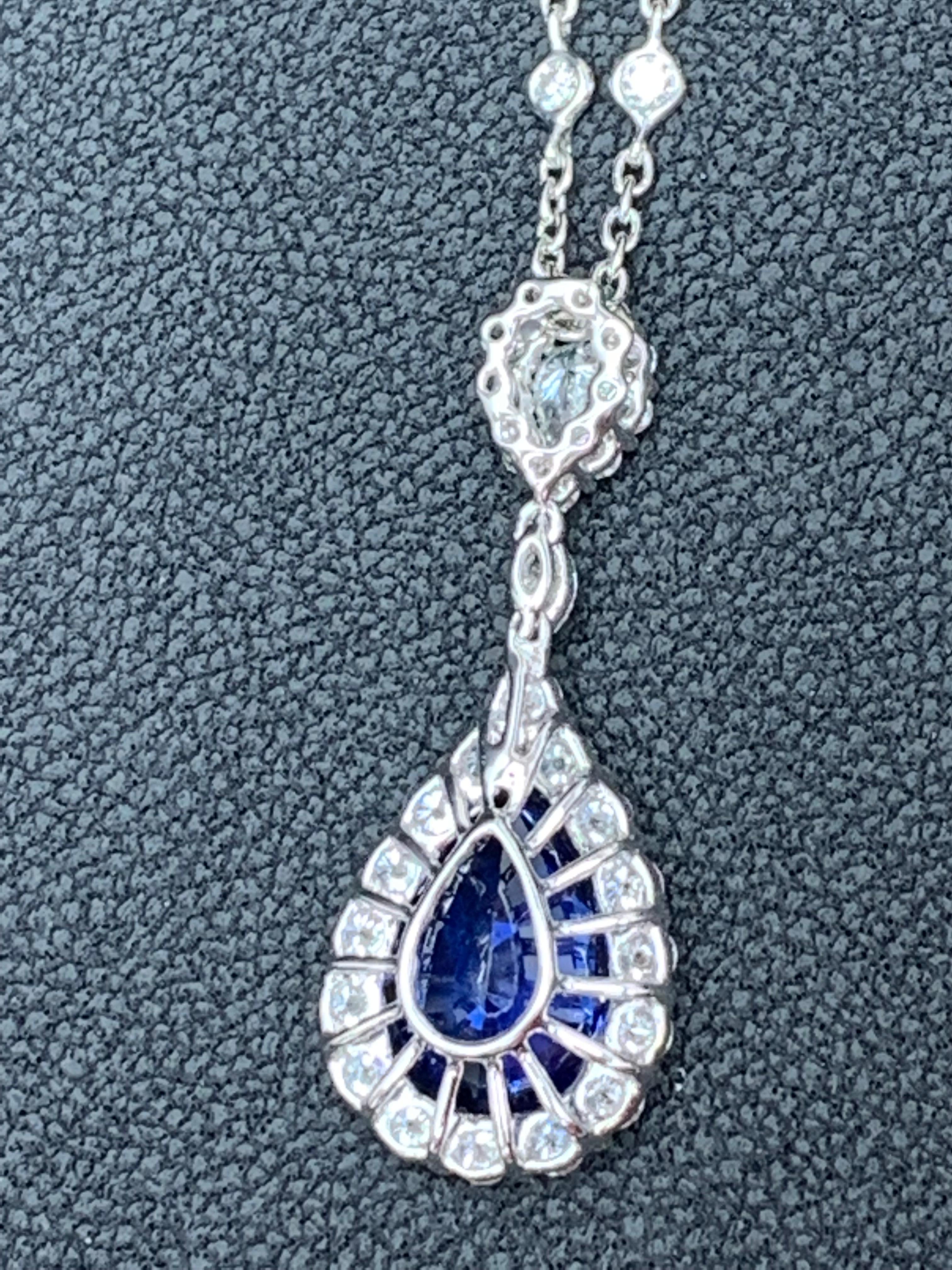 5.10 Carat Pear Shape Blue Saphire and Diamond Halo Drop Pendant Necklace In New Condition For Sale In NEW YORK, NY