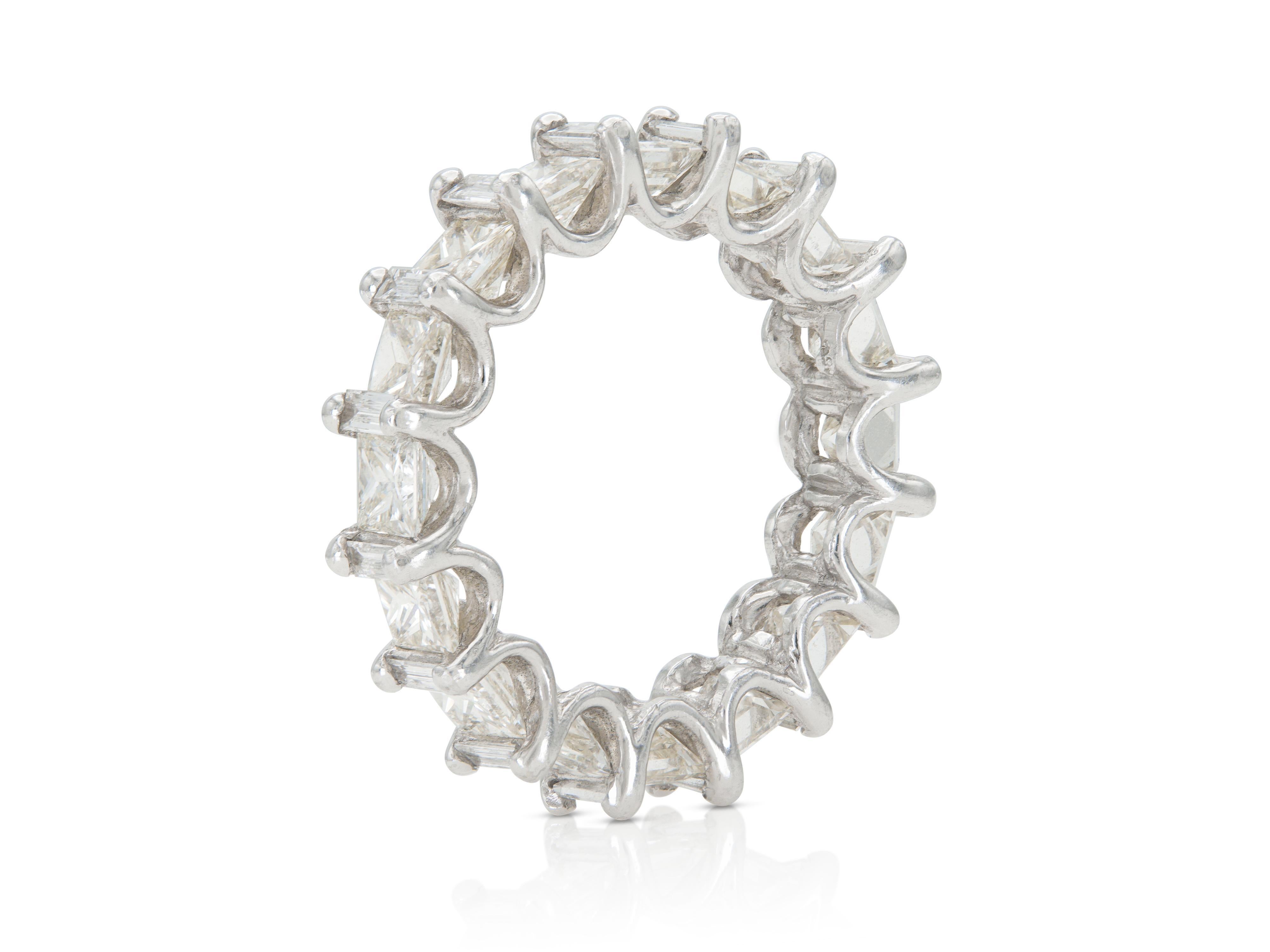 Finely crafted in platinum with Princess and Baguette cut Diamonds weighing a total of approximately 5.10 carats, I-J, VS2-SI1.
5 mm wide
Size 5 3/4