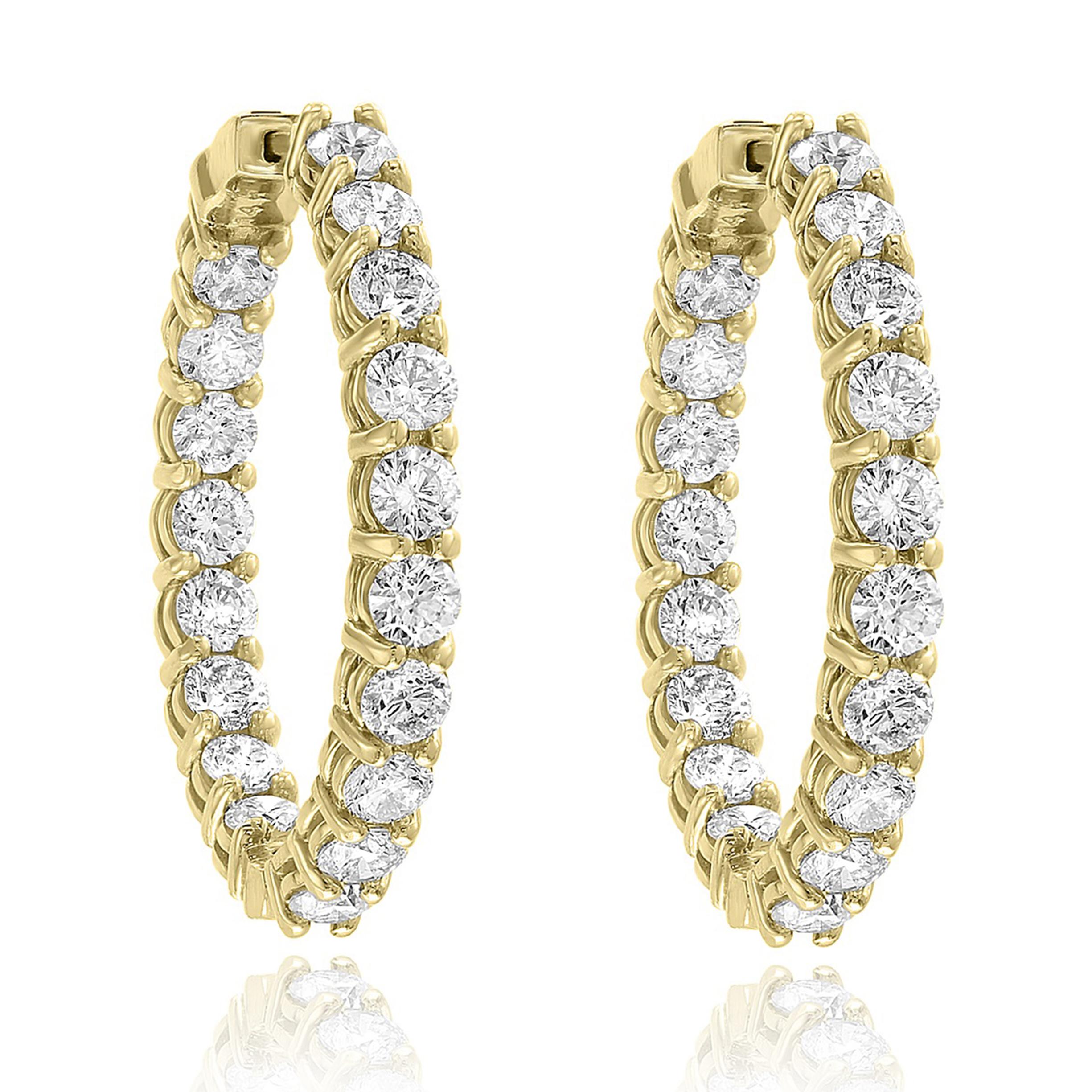 A chic and fashionable pair of hoop earrings showcasing  round diamonds, set in 14k yellow gold.  36 Round diamonds weigh 5.10 carats total. A beautiful piece of jewelry.


All diamonds are GH color SI1 Clarity.
Available in Yellow and Rose Gold as