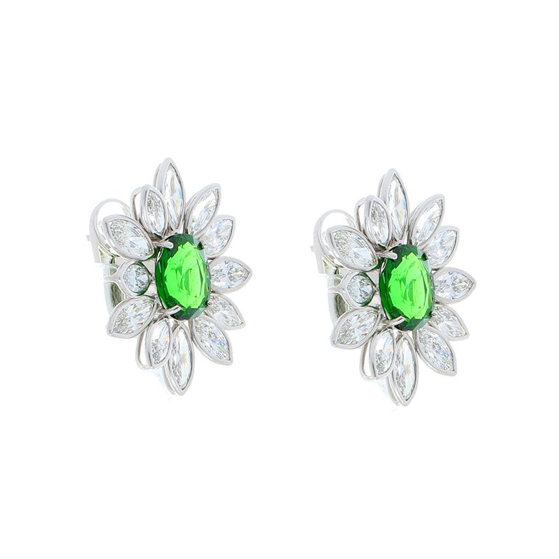 Nature is one of the greatest inspirations for artisan design, and these attractive floral earrings are proof of that! These earrings feature dazzling marquise diamonds as petals, with bright, vivid green tsavorite that add an enormous pop of color