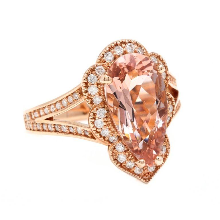 5.10 Carats Exquisite Natural Morganite and Diamond 14K Solid Rose Gold Ring

Total Natural Pear Shaped Morganite Weights: Approx. 4.50 Carats

Morganite Measures: Approx. 15.00 x 8.00mm

Morganite Treatment: Heat

Natural Round Diamonds Weight: