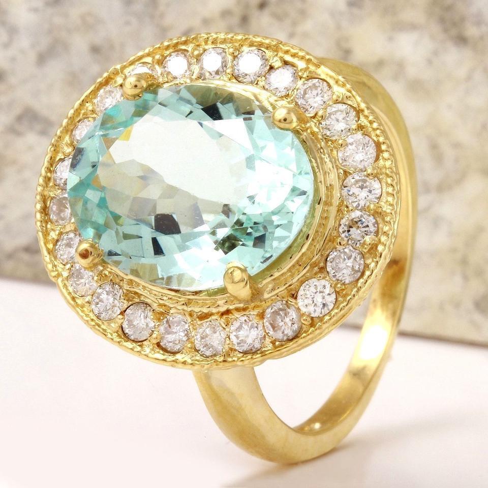 5.10 Carats Natural Aquamarine and Diamond 14K Solid Yellow Gold Ring

Total Natural Oval Cut Aquamarine Weights: Approx. 4.20 Carats

Aquamarine Measures: Approx. 12.90 x 10mm

Natural Round Diamonds Weight: Approx. 0.90 Carats (color G-H / Clarity